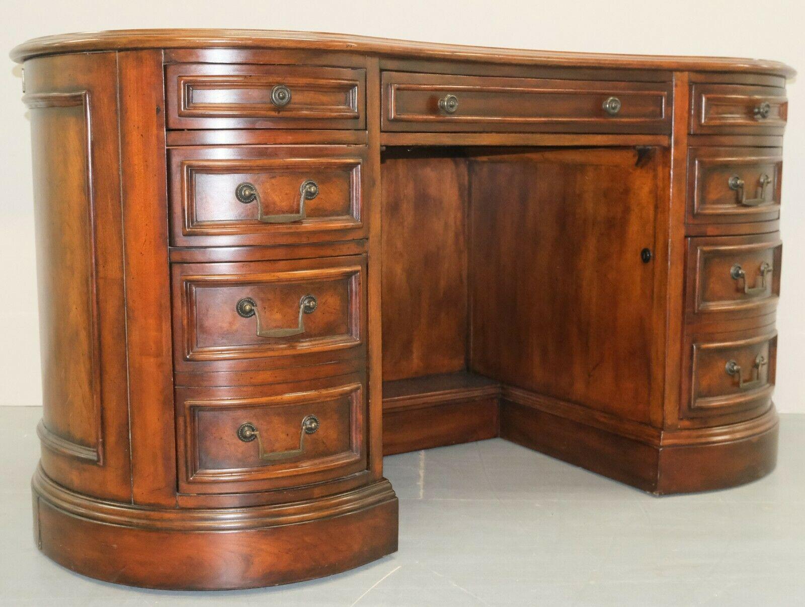 We are delighted to offer for sale this gorgeous Vintage Hardwood brown kidney desk with seven drawers.

The look of the desk is simply lovely, being able to add style to any room. The item will work for a PC as it does have some space cut where