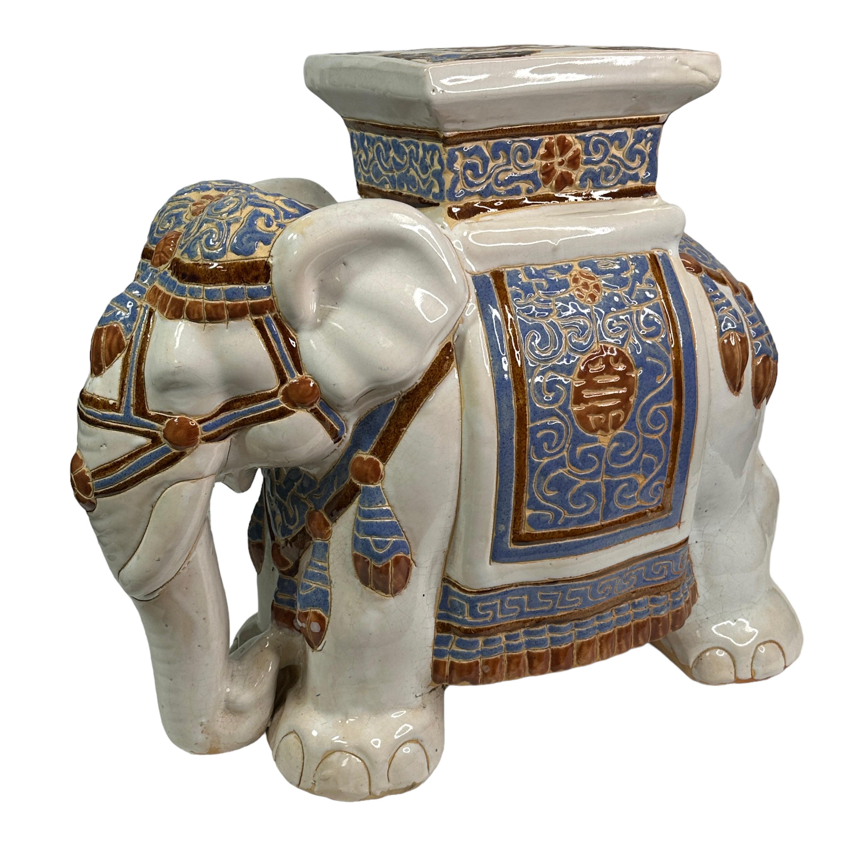 Mid-20th century glazed ceramic elephant garden stool, flower pot seat or side table. Handmade of ceramic. Nice addition to your home, patio or garden. Also great as a drinks stand in your pool area. Found at an estate sale in Vienna, Austria. 
    