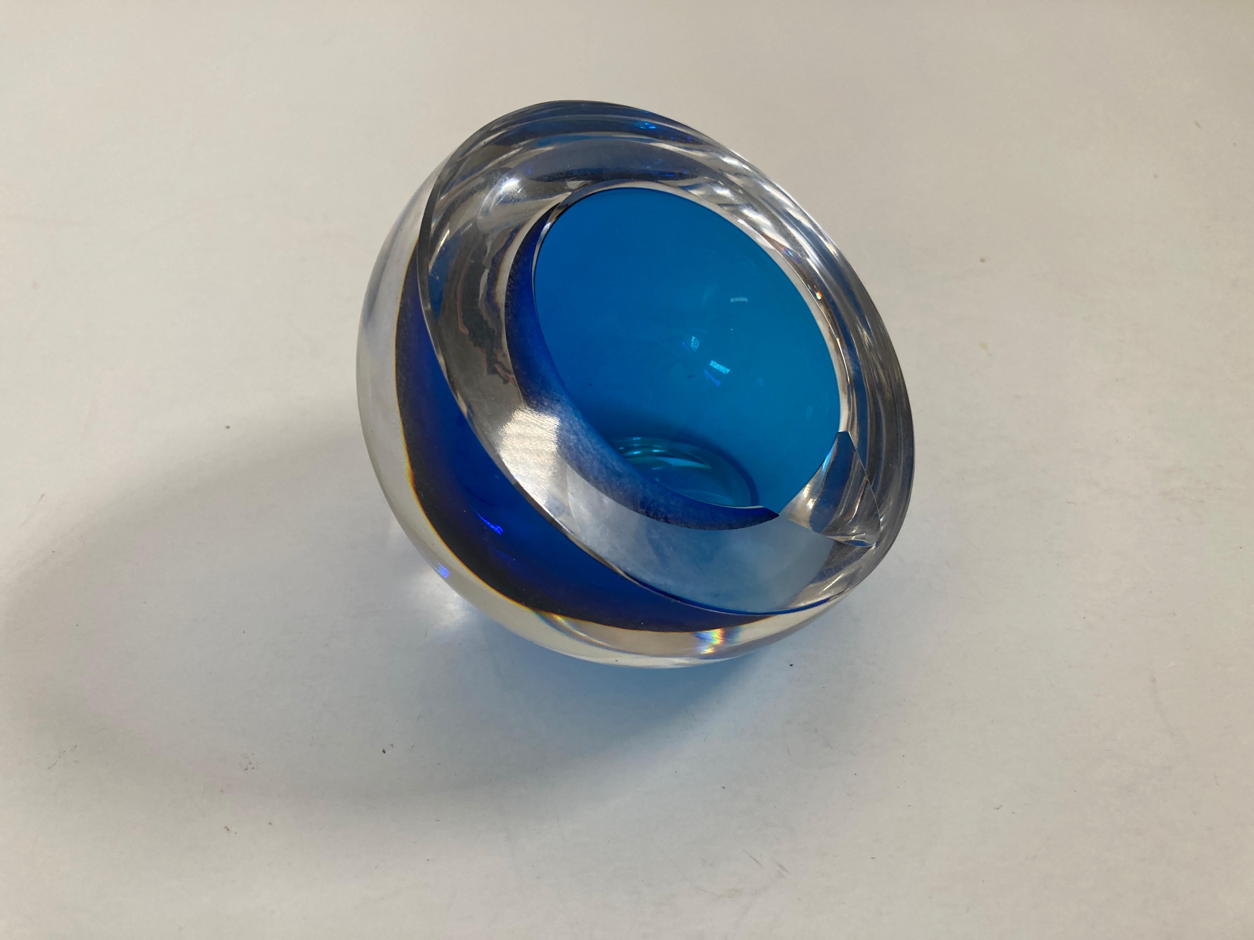 Gorgeous vintage Murano Venetian handblown art glass bowl or ashtray. 
Italian Murano Sommerso orb blue and clear art glass ashtray
Extremely hard to find a heavyweight glass ashtray in a gorgeous minimal design.
A very beautiful and substantial