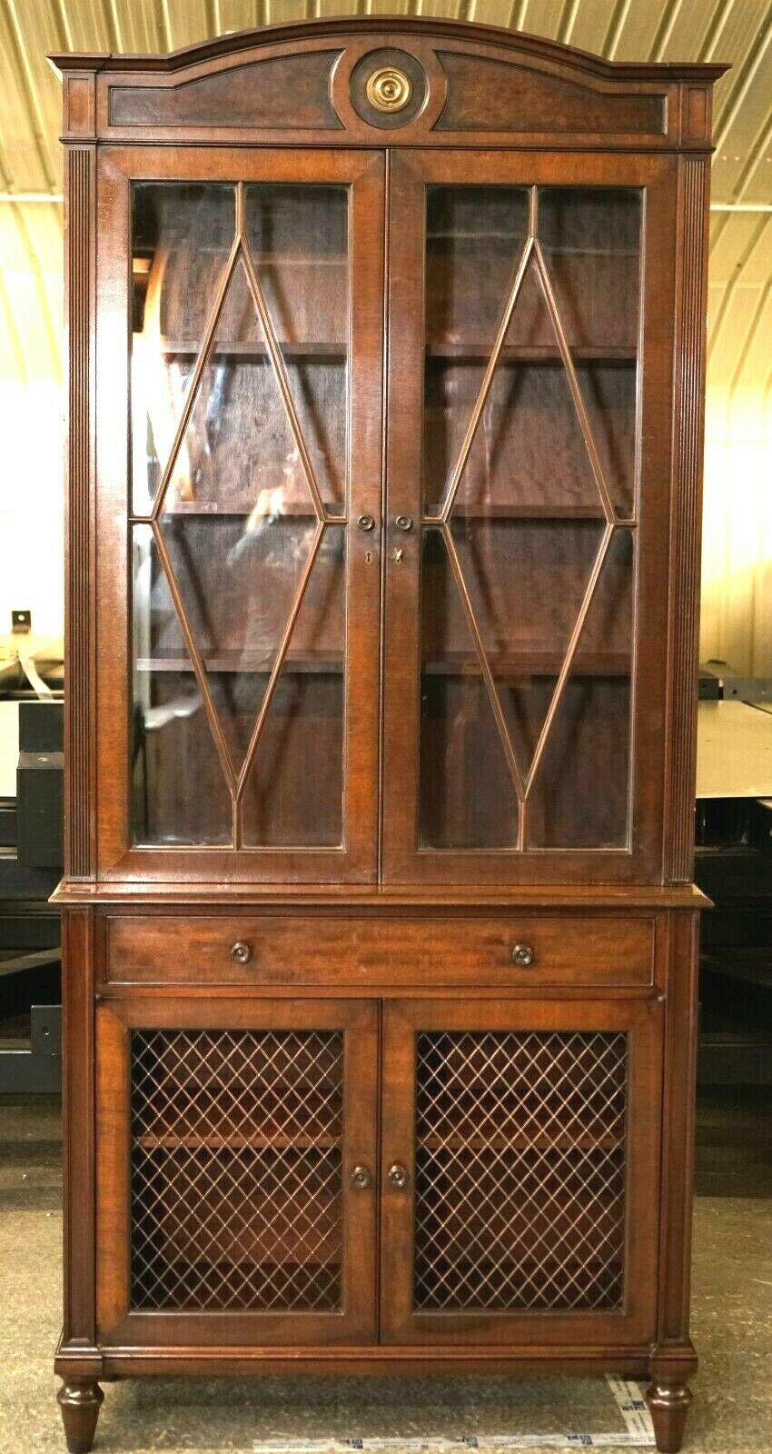We are delighted to offer for sale this gorgeous vintage cabinet/dresser with metal mesh on the bottom doors.

It comes with one key that works on both doors, it has three adjustable shelves on the top part and one also adjustable in the bottom