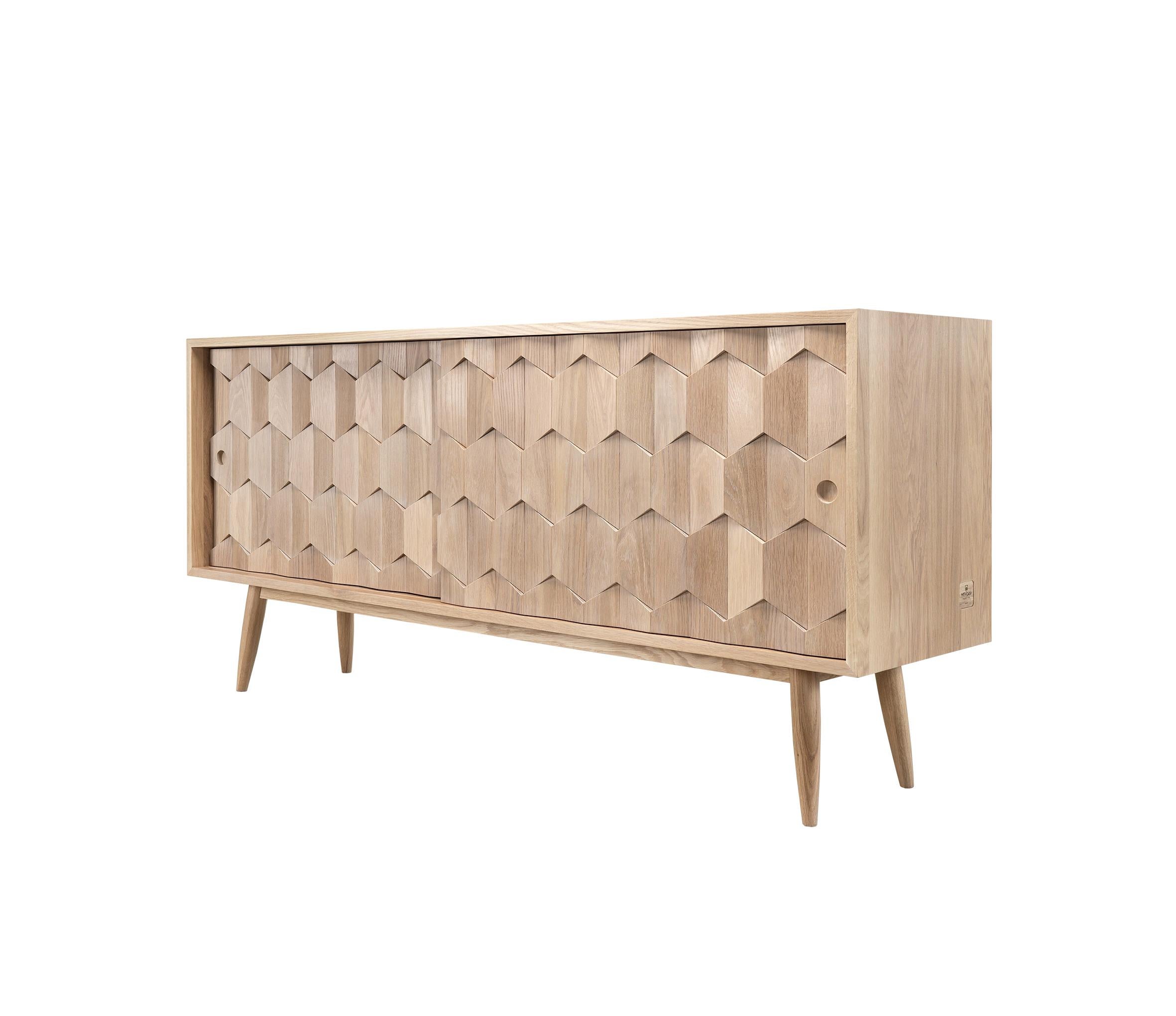 Very elegant and solid walnut or oak rectangular sideboard.
It has two hidden drawers and four divisions divided by adjustable shelves that allows you to store any type of objects. Details on the doors assembled by hand.
Packed in a plywood box