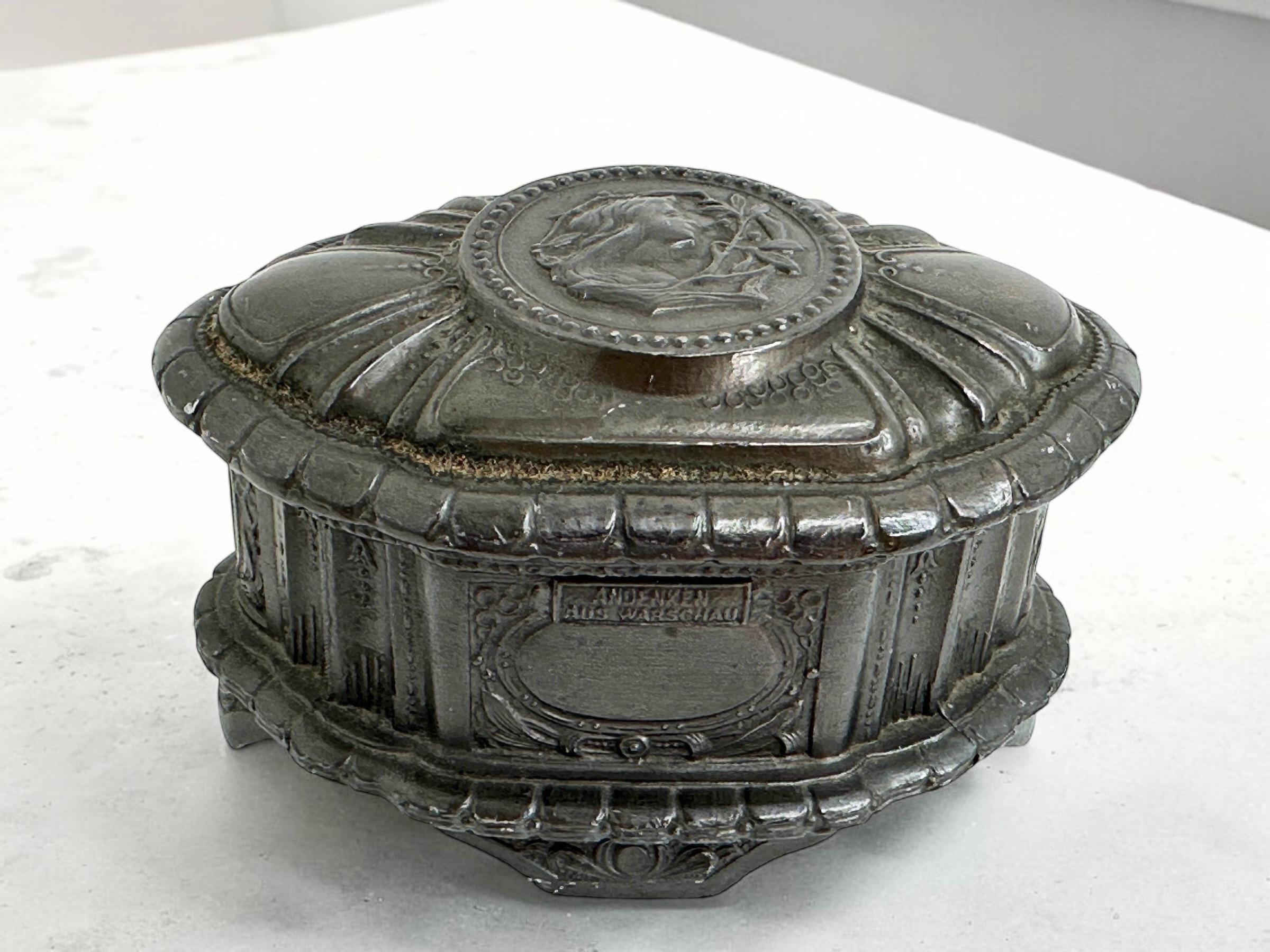 Beautiful souvenir trinket box made of metal. A beautiful nice addition to your vanity room or your collection of Grand Tour items. Its a souvenir box from Warsaw, its written in German so it is at least from the 130s or older.