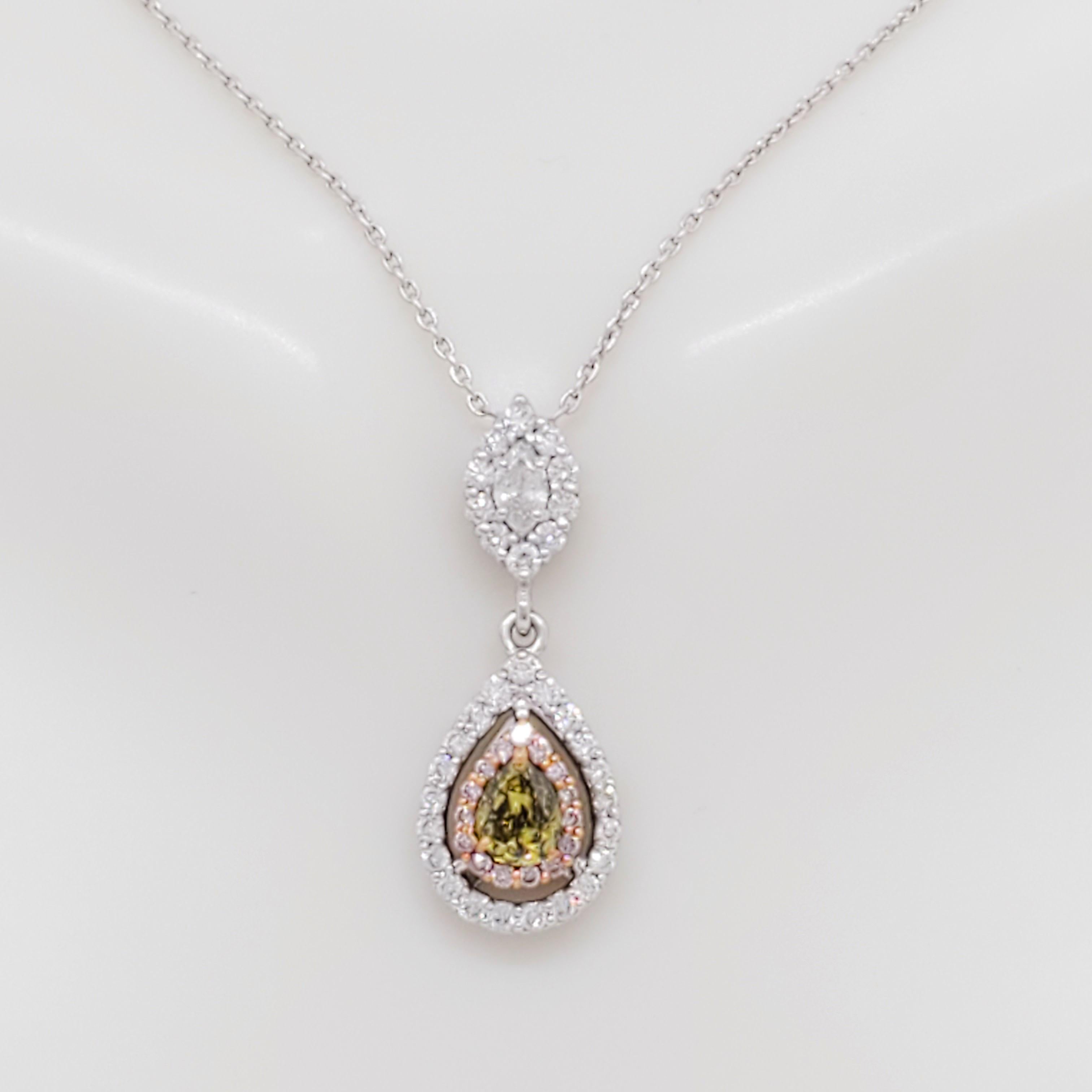 Gorgeous 1.00 ct. white and natural fancy multi color round, marquise, and pear shape diamonds in a handmade 18k white gold mounting.  Adjustable chain.