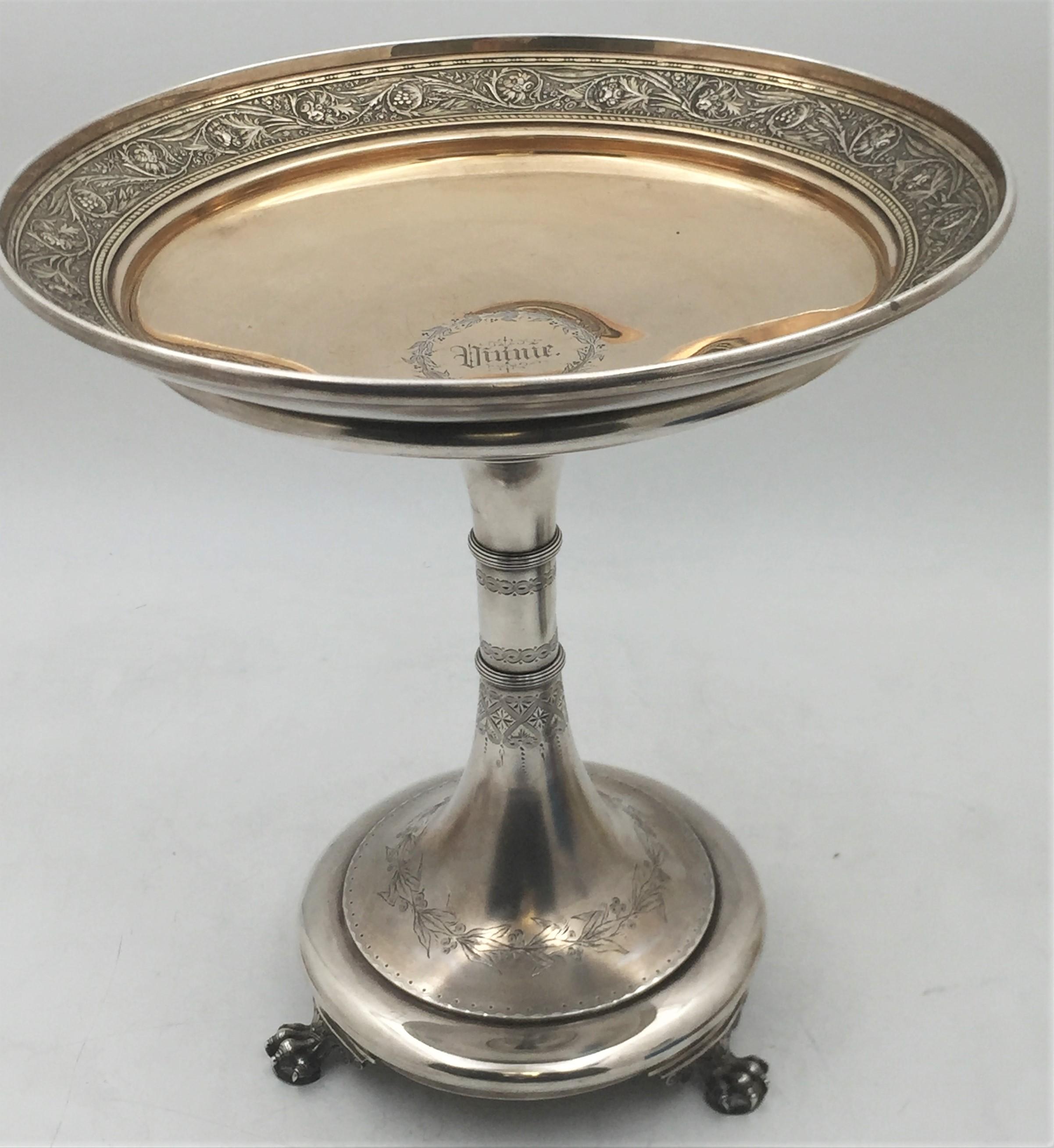 Magnificent Gorham, partially gilt sterling silver centerpiece stand from 1875 resting on 3 highly realistic claws. The stem is delicately engraved with floral and geometric motifs while the top displays exquisite, flowing natural motifs. It