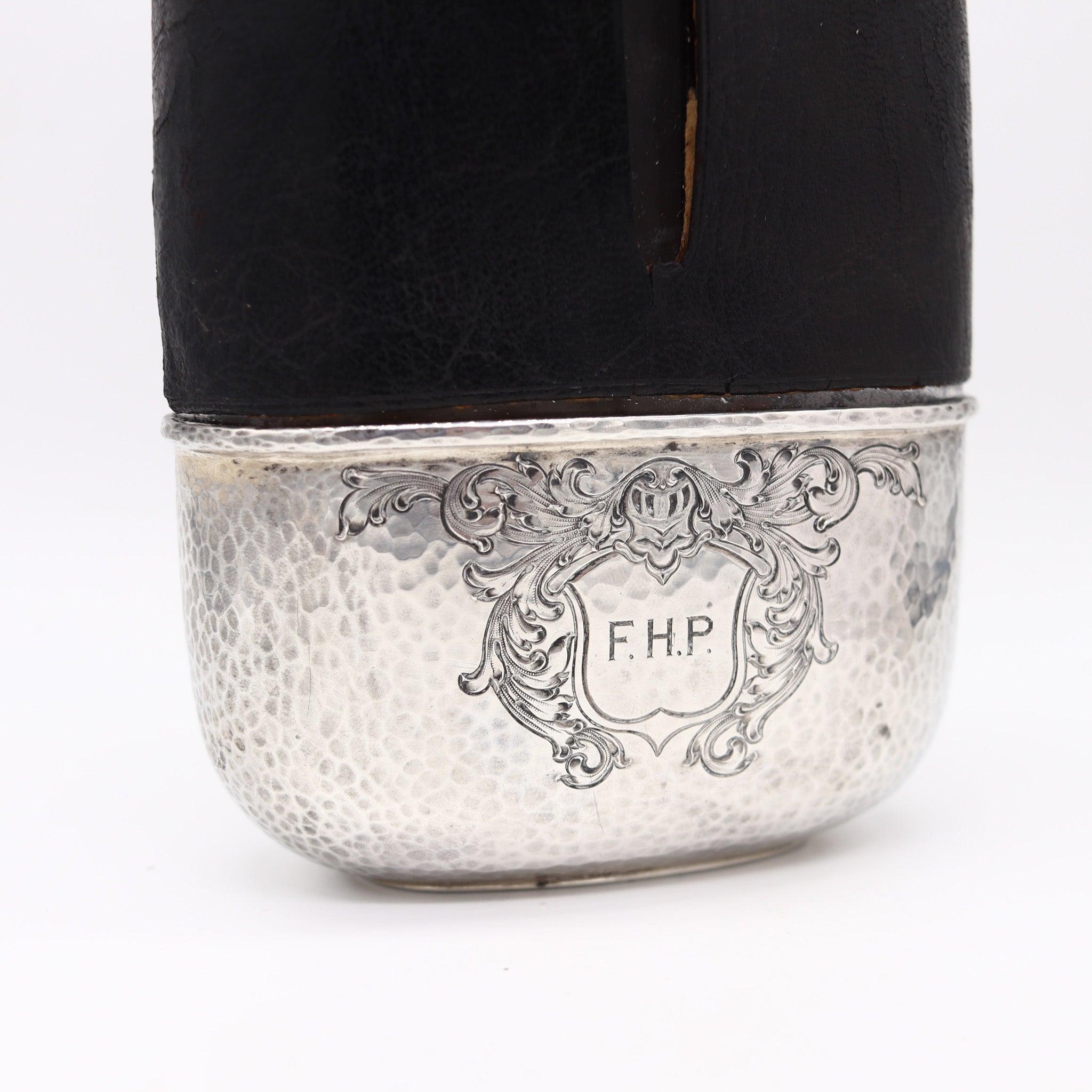 Liquor flask bottle designed by Gorham.

Very handsome and handy liquor flask bottle, created in America by the silversmiths of Gorham, back in the 1900. This beautiful large liquor flask has been crafted with parts made up in solid sterling silver