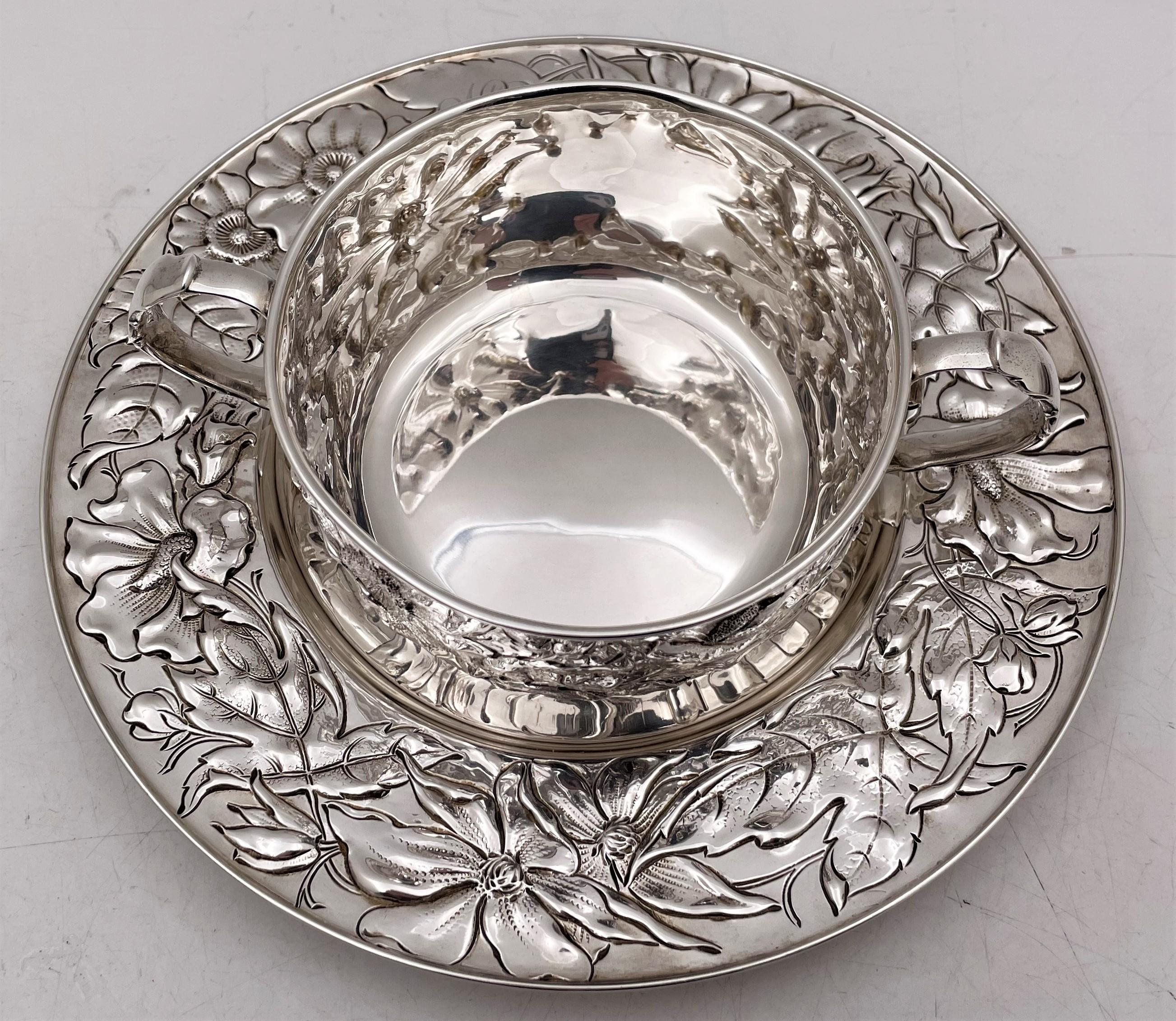 Gorham sterling silver mug and underplate from 1900, in Art Nouveau style. The style, with exquisite, flowing floral motifs, and craftsmanship are reminiscent of the great Martele line. The mug measures 6 1/2'' from handle to handle by 2 1/4'' in