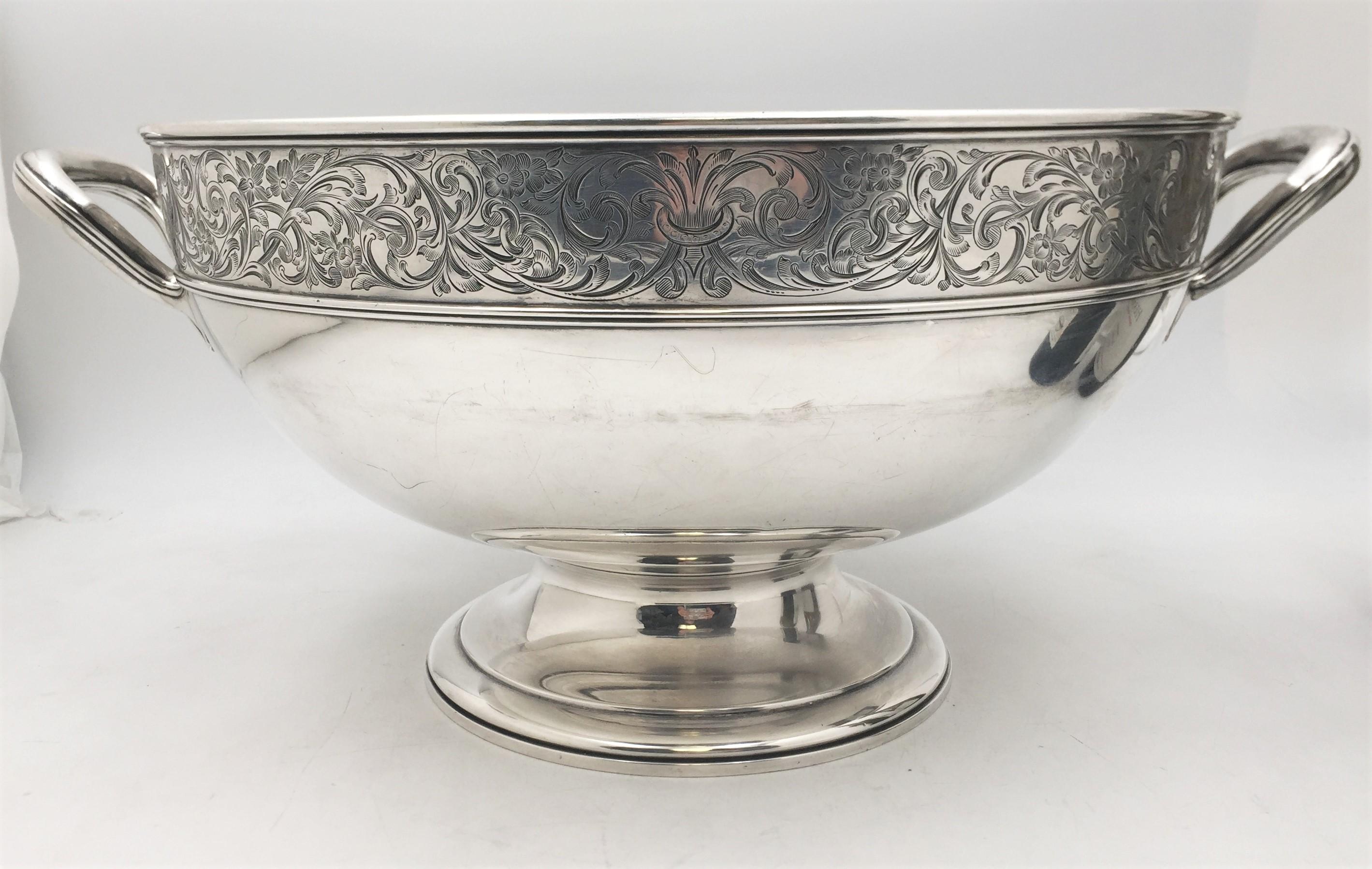 Monumental Gorham, sterling silver wine chiller or centerpiece bowl from 1908 with two handles decorated with a floral frieze across and bearing a dedicatory inscription to Seelye, the president of Smith College at the time. This impressive piece