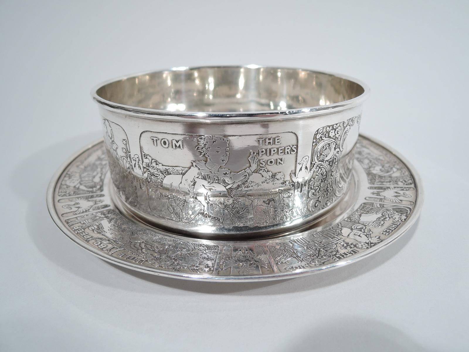 Edwardian sterling silver cereal bowl on plate. Made by Gorham in Providence, ca. 1910. The bowl has straight sides and molded rim. The plate has plain well and molded rim.

Scenes from nursery rhymes acid-etched on both pieces. On the bowl are