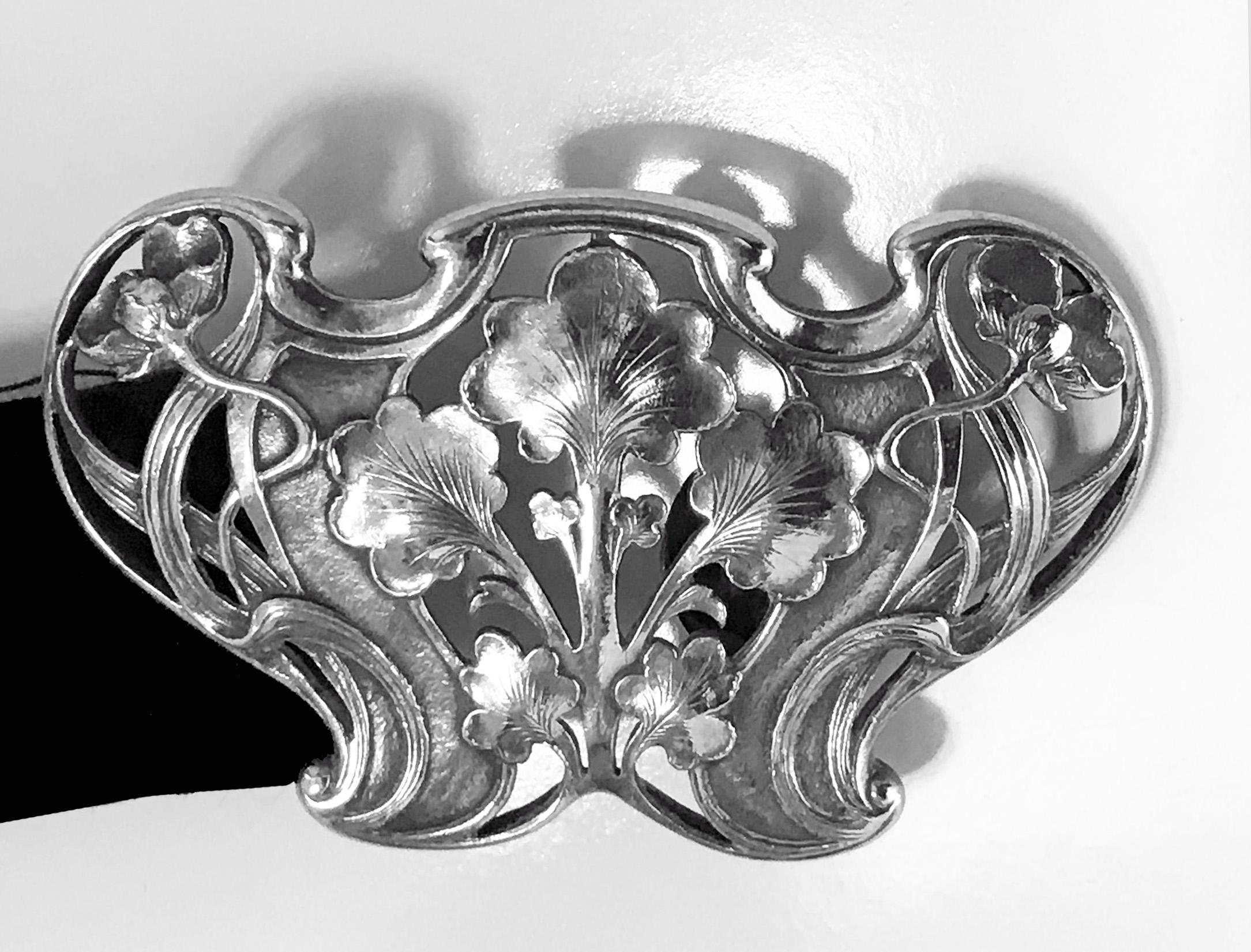 Gorham Art Nouveau sterling buckle, 1902. Marks for Gorham Sterling and B1949 copyrighted with 1902 (year). Beautiful open floral nouveau whiplash design against stippled background. Measures: 2.75 x 1.75 inches.