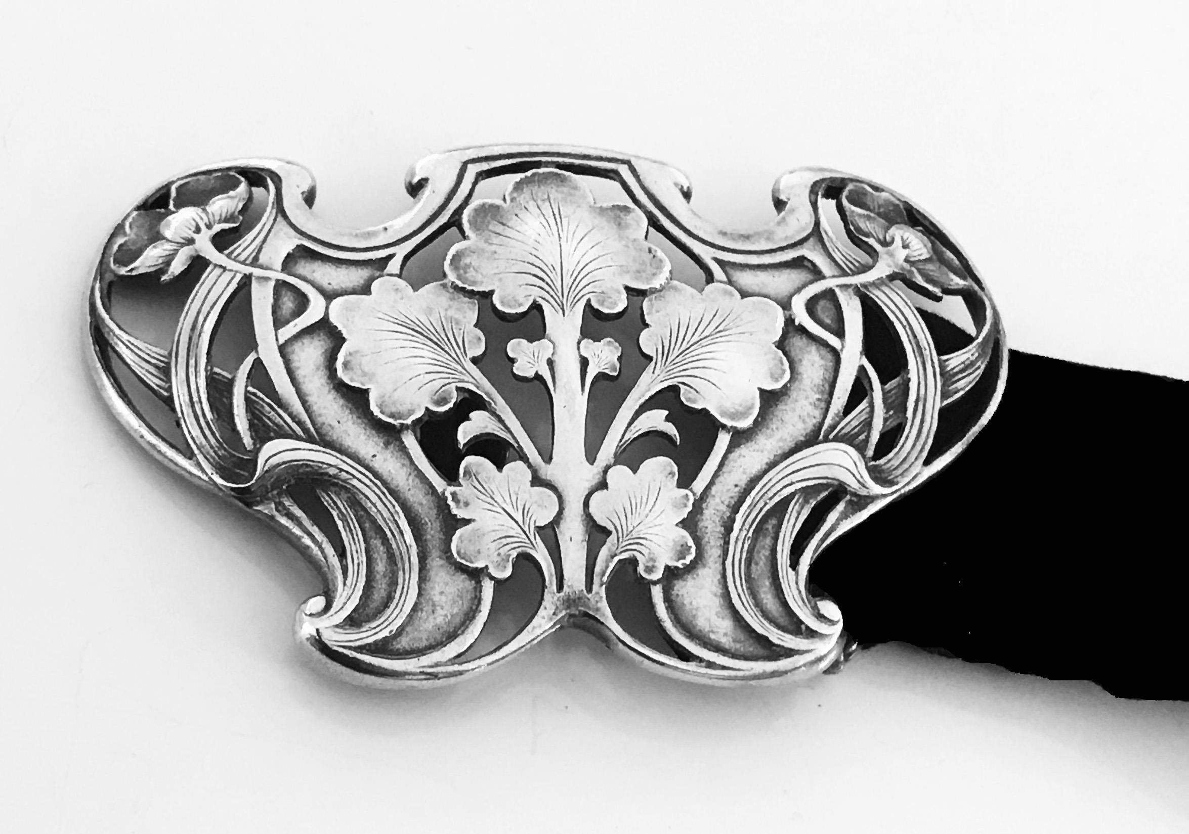 Gorham Art Nouveau Sterling Buckle, 1902. Marks for Gorham Sterling and B1949 copyrighted with 1902 (year). Beautiful open floral nouveau whiplash design against stippled background. Measures: 2.75 x 1.75 inches.