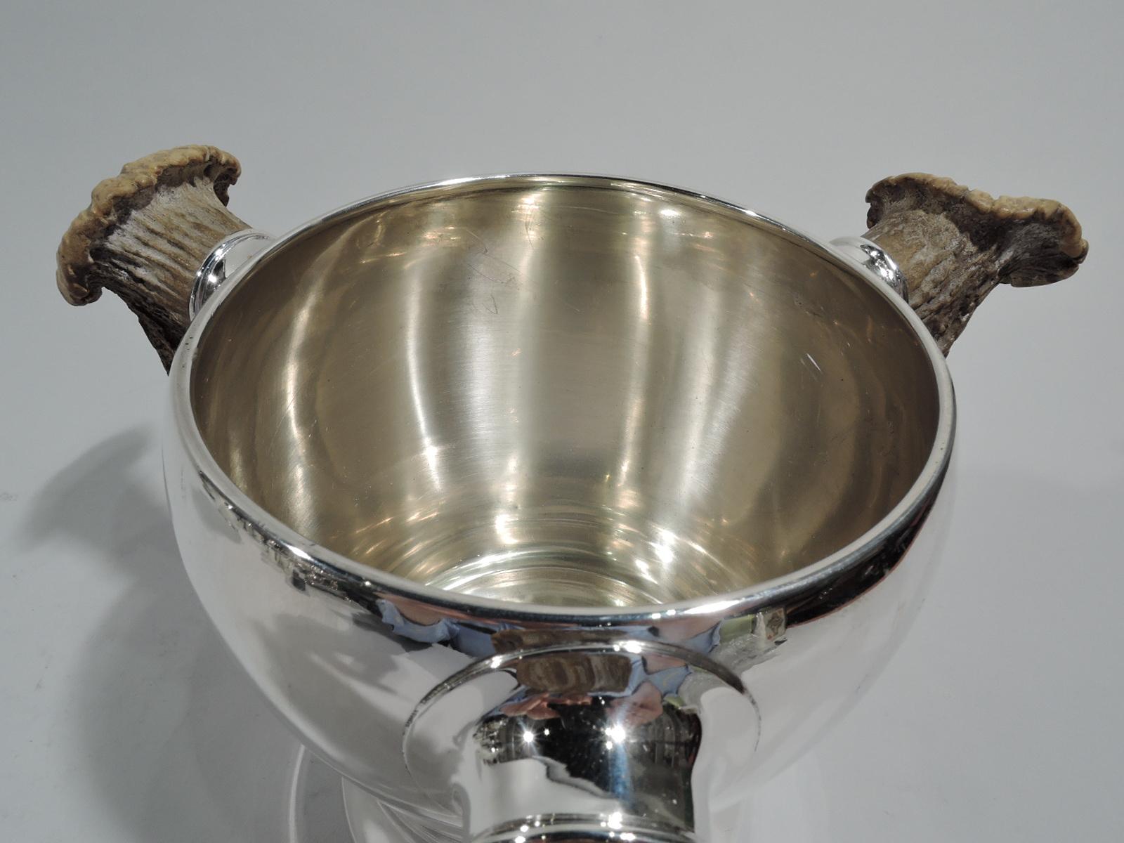 Turn-of-the-century sterling silver loving cup. Made by Gorham in Providence. Voluptuous baluster with 3 silver-mounted antler handles. A big game-era trophy for an alpha winner. Lots of room for engraving a bold and forthright presentation. Holds