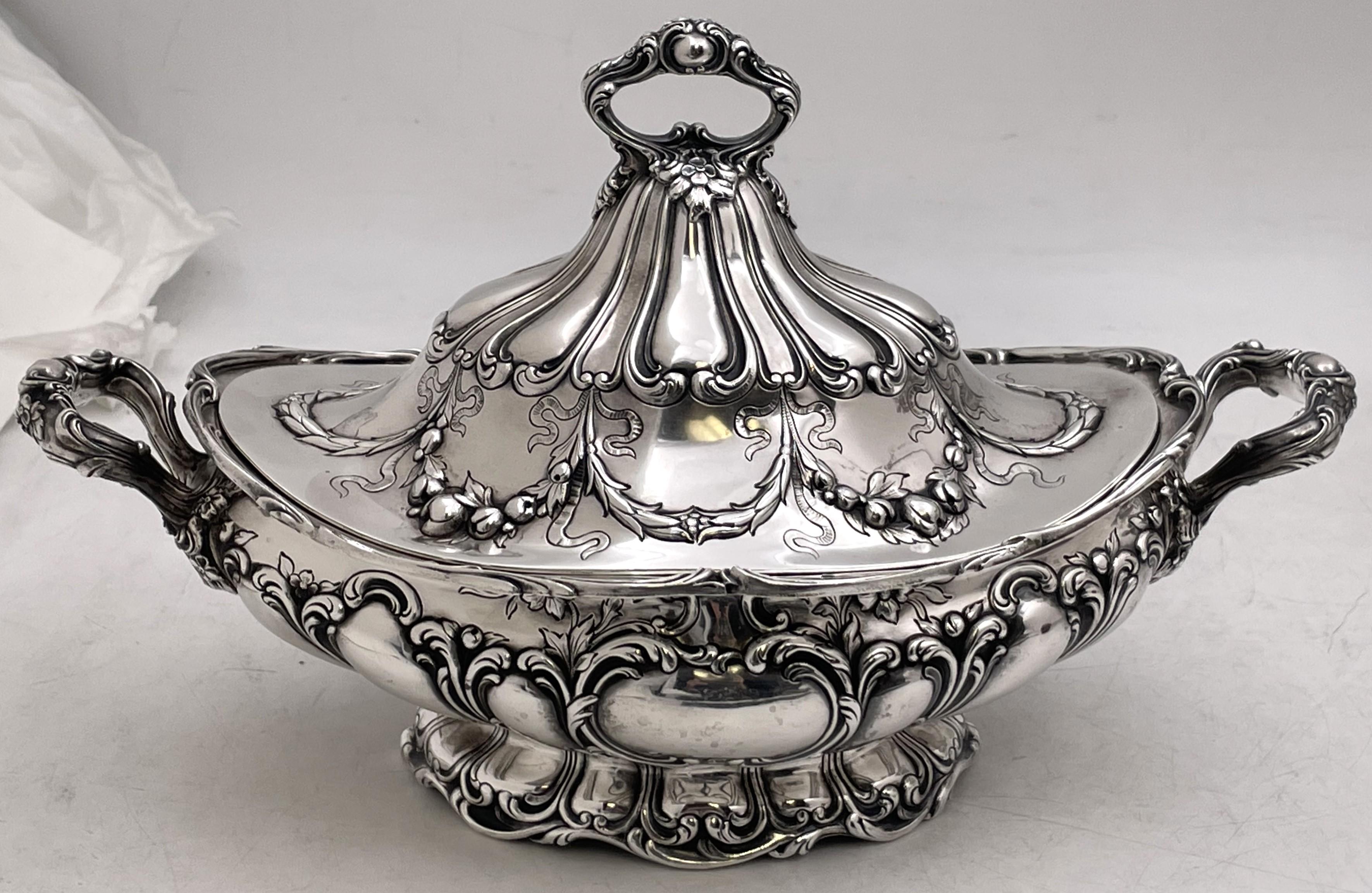 Pair of Gorham sterling silver covered tureens in the Grande Chantilly pattern, made circa 1900, in Art Nouveau style, the bodies and handles being beautifully adorned with raised floral and natural motifs. Finely crafted with graceful elegance