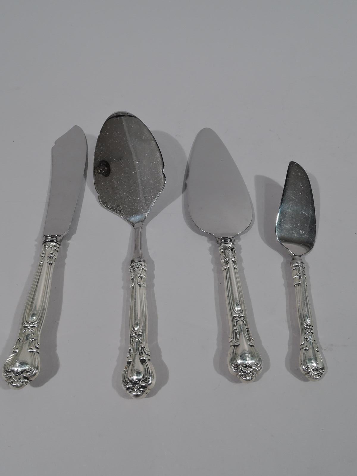 Sterling silver set in Chantilly pattern. Made by Gorham in Providence.

This set comprises 96 pieces (dimensions in inches): Forks: 12 regular forks (7), 11 salad forks (6 1/2), and 12 seafood cocktail forks (5 1/2); Spoons: 24 teaspoons (5 7/8)