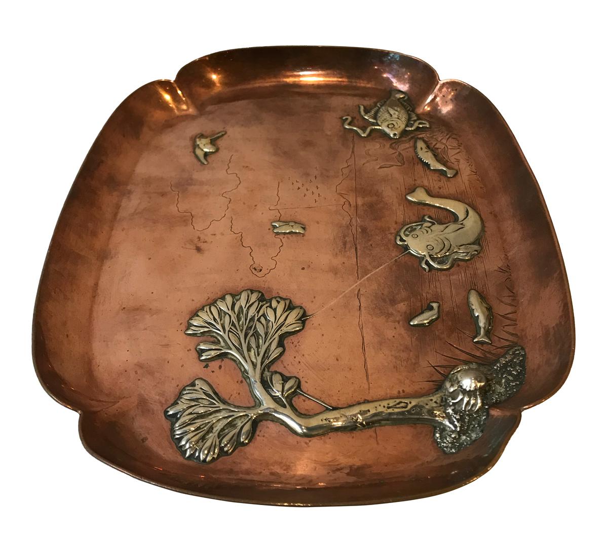 Astonishing and precious this mixed metals tray is very rare, from American Aesthetic Movement inspired by the Japonism style. 
The base of the tray is of heavy copper with an original patina and ornated with delicate sterling silver decorations,
