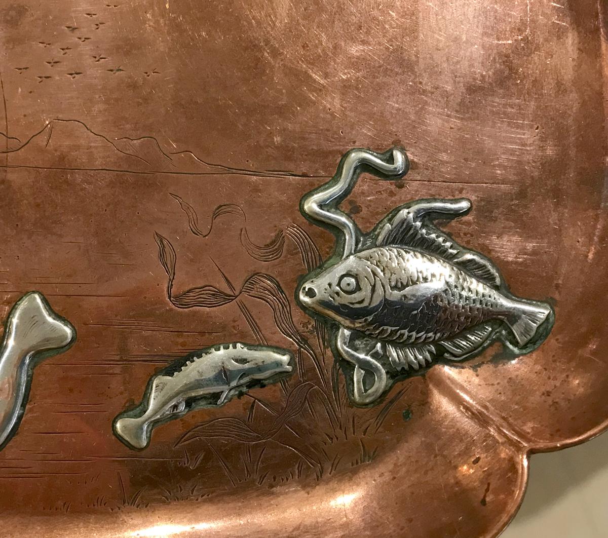 silver on copper tray with crown symbol