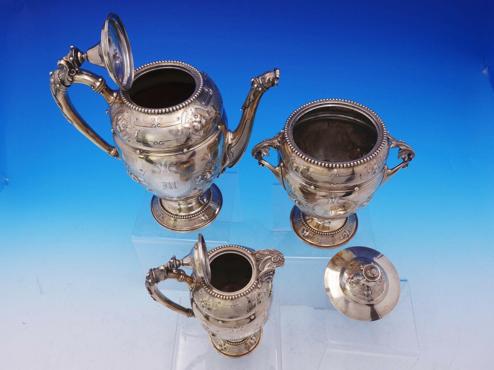 Gorham

Outstanding early Gorham coin silver 3-piece coffee set marked #30. It is beautifully hand chased and features repouseed flowers. Applied cast scrolly handles on the sugar bowl. Applied beading. There is a vintage monogram M on all of the