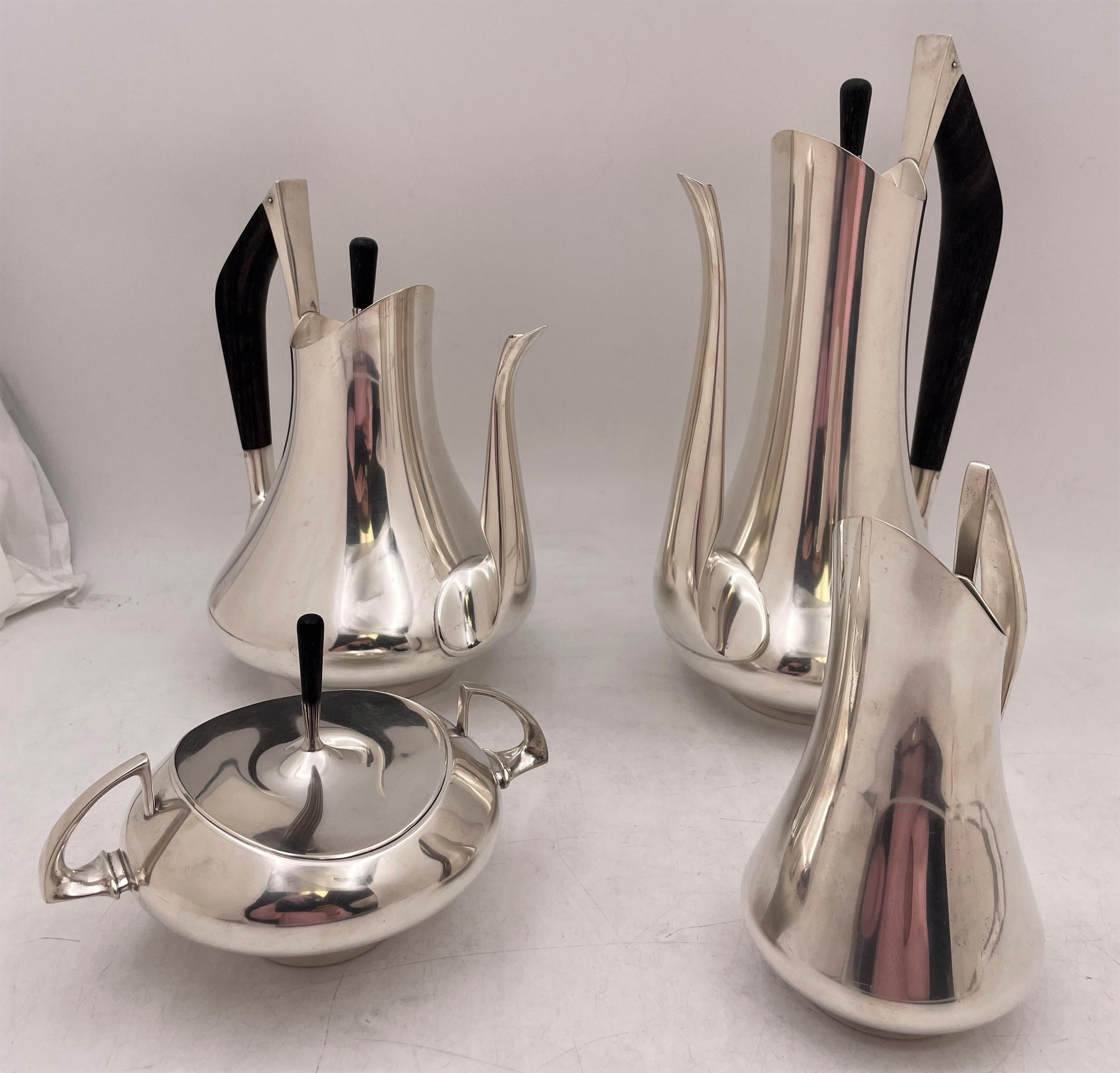 Gorham by Donald Colflesh 5-piece Sterling Tea Set in Mid-Century Modern style from 1967 consisting of:

- a coffee pot measuring 12'' by 7''

- a tea pot measuring 9 1/2