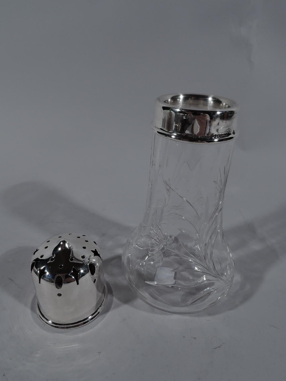 Fresh and pretty Edwardian modern crystal sugar Shaker with sterling silver cover. Made by Gorham in Providence in 1913. Cylindrical with bellied bowl; cut and stylized stem flowers. Cover has tiny pointy bit surrounded by ornamental piercing. Fully