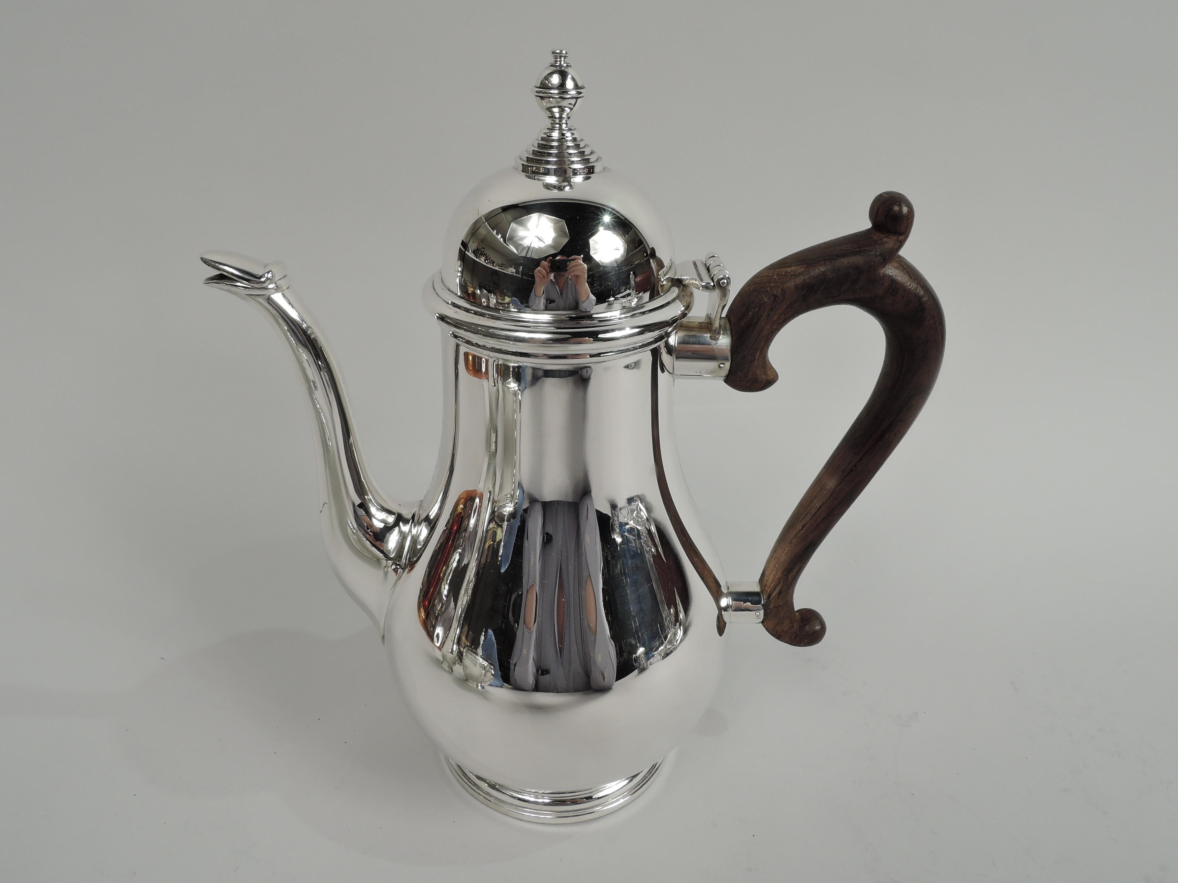 George I-pattern sterling silver coffee set. Made by Gorham in Providence in 1956. This set comprises 3 pieces: coffeepot, creamer, and sugar. Georgian forms with baluster bodies (coffeepot and creamer), round and stepped foot, and vasiform finials