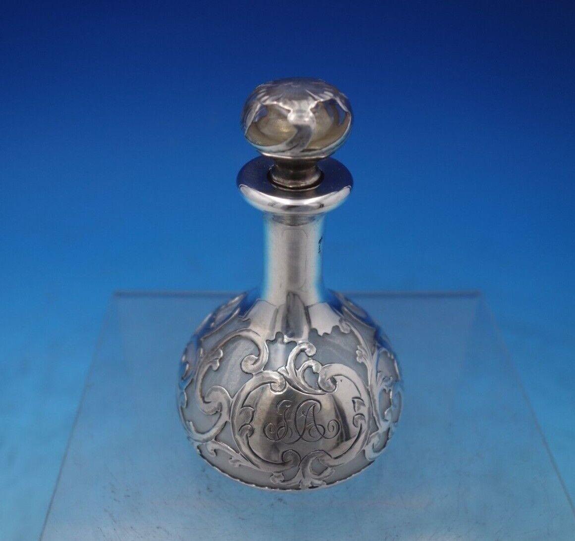 Gorham

Pretty Gorham clear glass perfume bottle with silver overlay marked #D236. This bottle measures 3 5/8