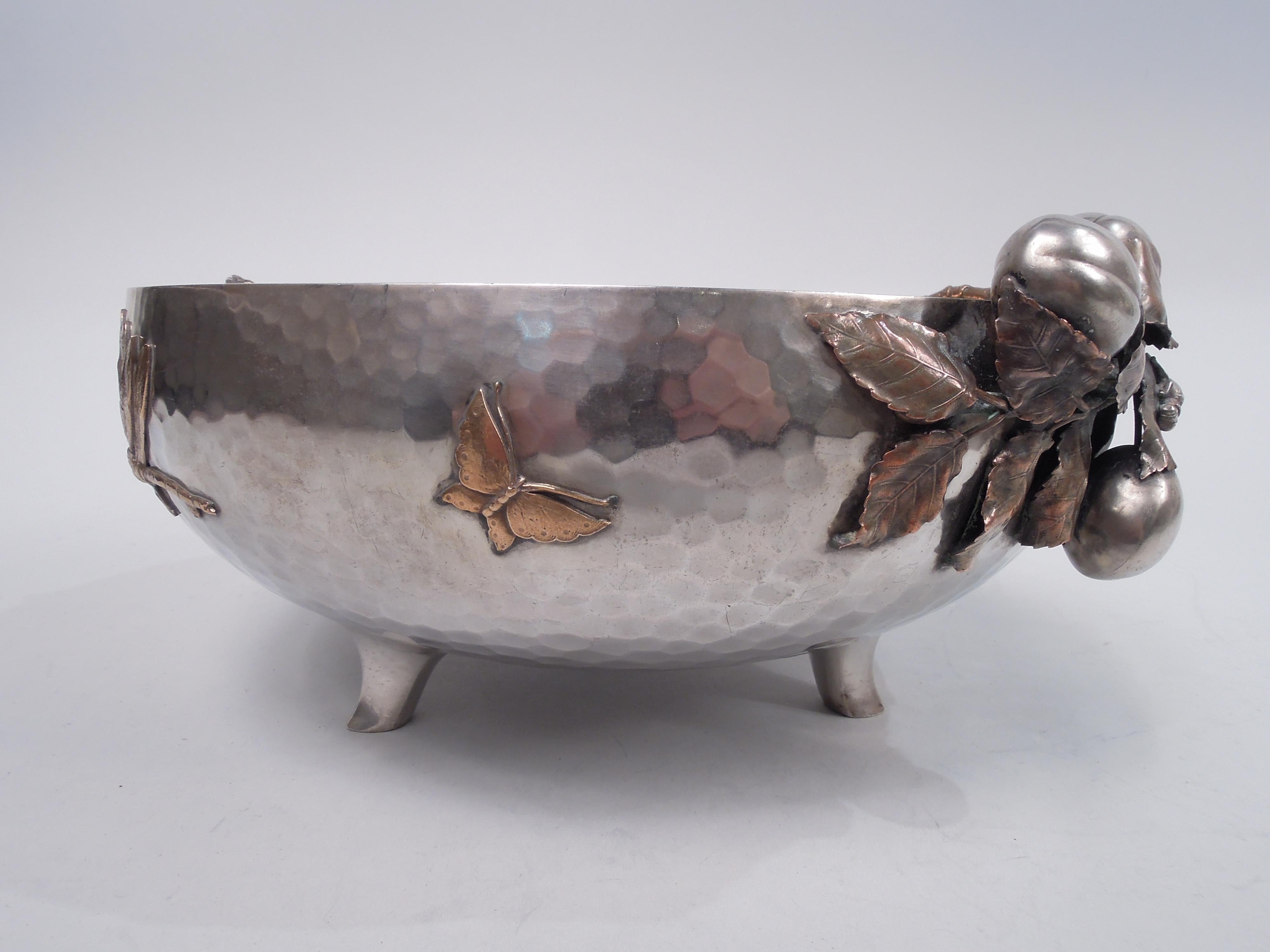 Japonesque mixed metal sterling silver bowl. Made by Gorham in Providence in 1883. Curved sides with allover spot hammering and gilt-washed interior. Applied copper and silver ornament: Rim overhung with fruiting and leafing branch mounted to