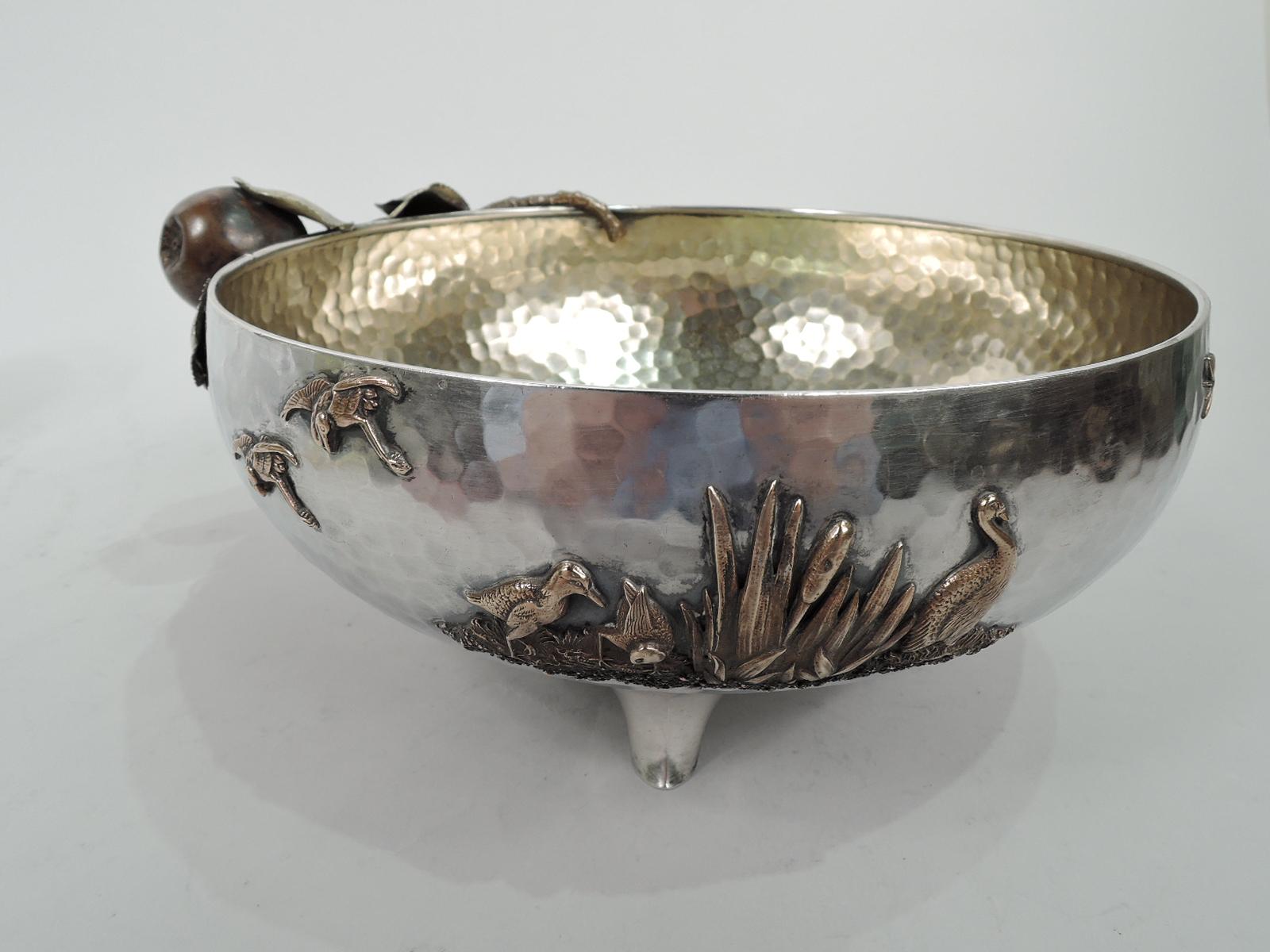 Japonesque mixed metal on sterling silver bowl. Made by Gorham in Providence in 1883. Curved sides with allover spot hammering and gilt-washed interior overhung with apple branch mounted to exterior. A gnarly growth with irregular fruit and gilt