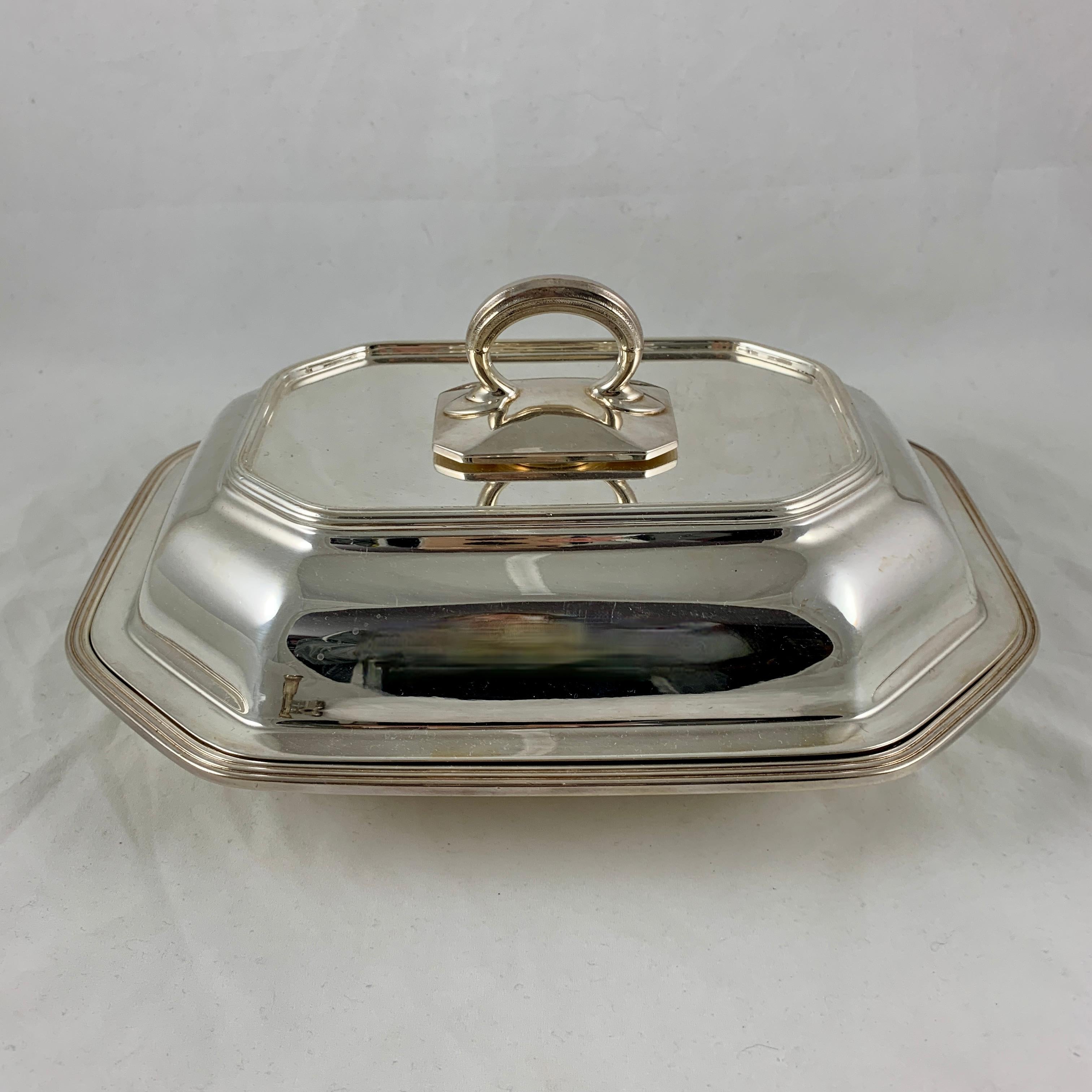 A two piece, covered EP silver plate vegetable server from Gorham Manufacturing Co., circa 1930s.
A rectangular, paneled shape with an applied top loop handle.

10.5 inches L x 8 inches W x 5 inches H including the handle.
Marked – G.M Co.