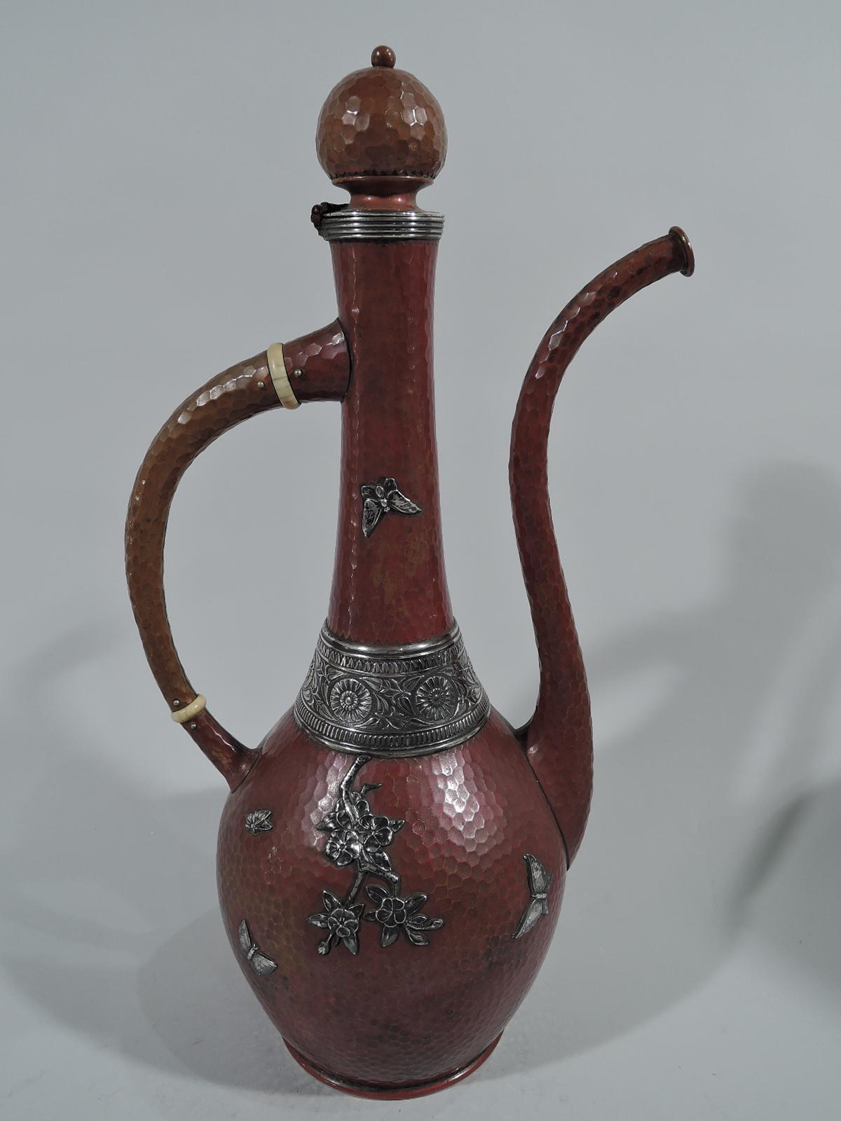 Mixed metal copper and silver Turkish coffeepot with Japonesque ornament. Made by Gorham in Providence in 1882.

Traditional copper vessel comprising ovoid body, S-scroll spout, c-scroll handle, cylindrical neck, and hinged onion-dome cover. Applied