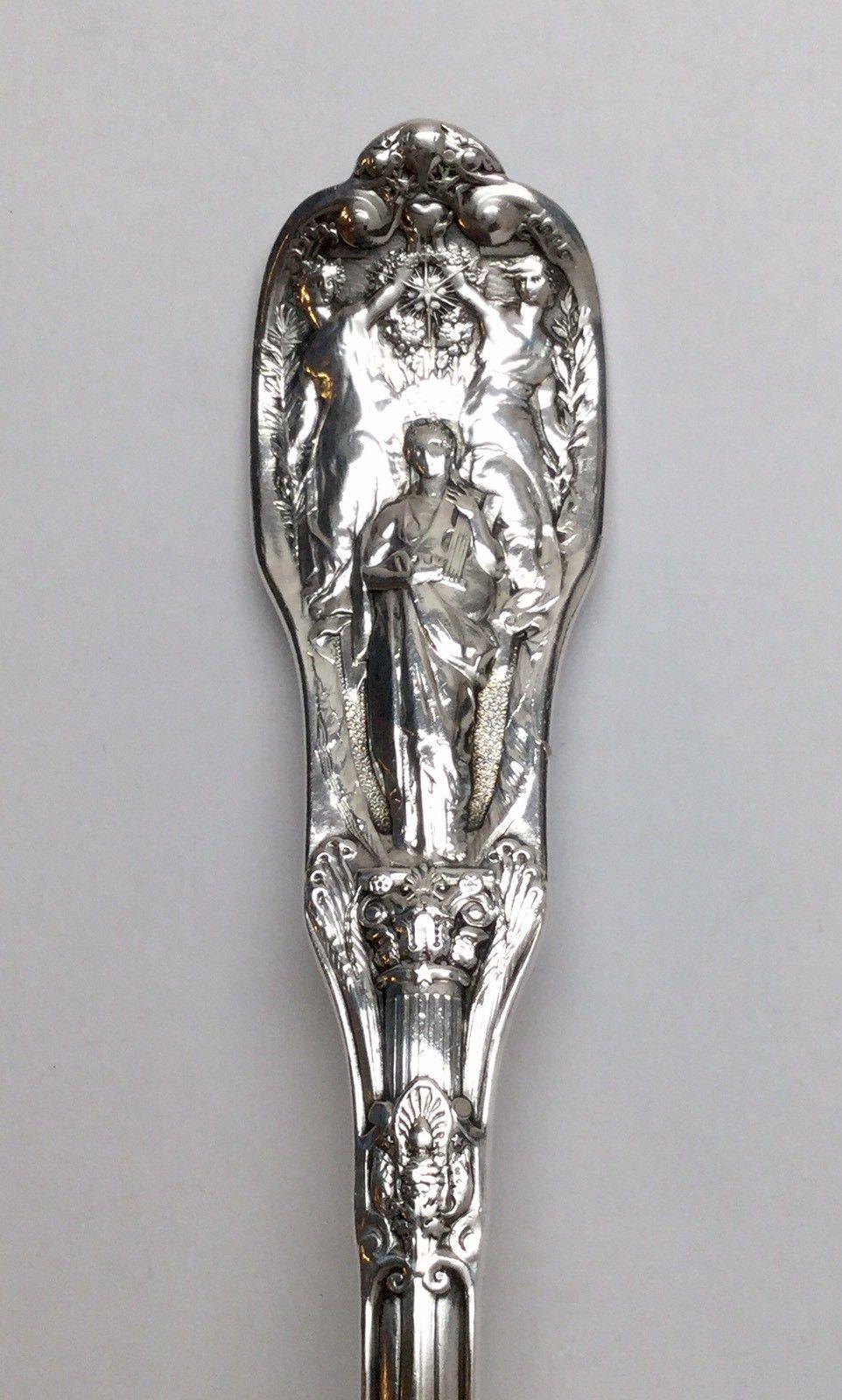 Gotham Mythologique 1894 sterling silver berry casserole serving spoon. 
Marked: lion anchor G, STERLING. 
No monogram. 
Measures: 8 3/8