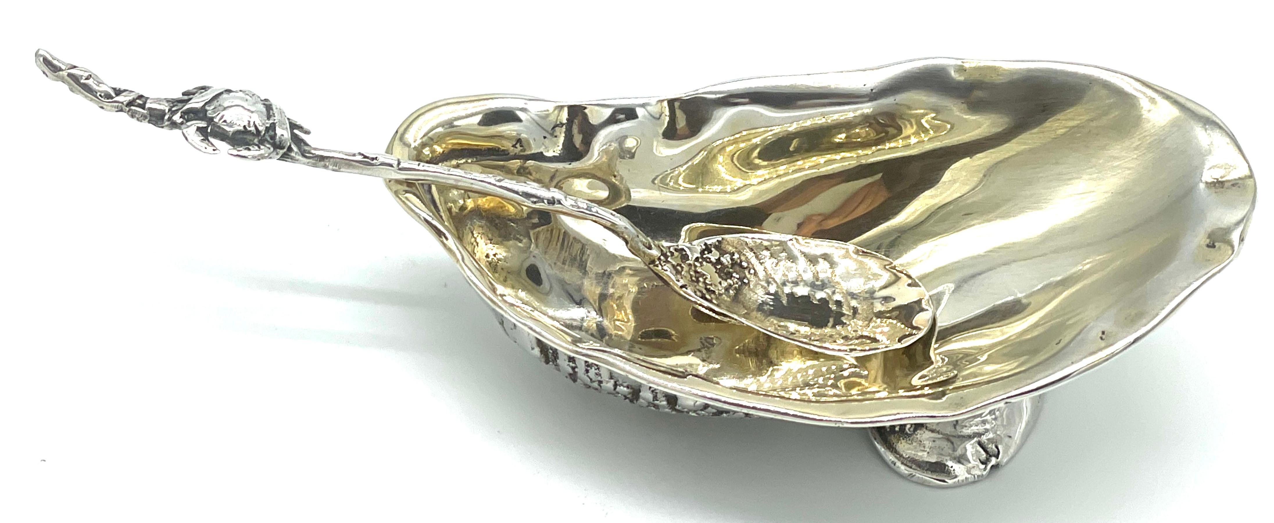 Gorham  'Narragansett' Gold Washed Sterling Shell Dish & Figural Crab Spoon 
USA, circa 1890s 
A rare find, two piece set in one of scarcest patterns of the Gorham Mfg. Co. 'Narragansett', a sculptural Shell Dish & Figural Crab Spoon, this offering