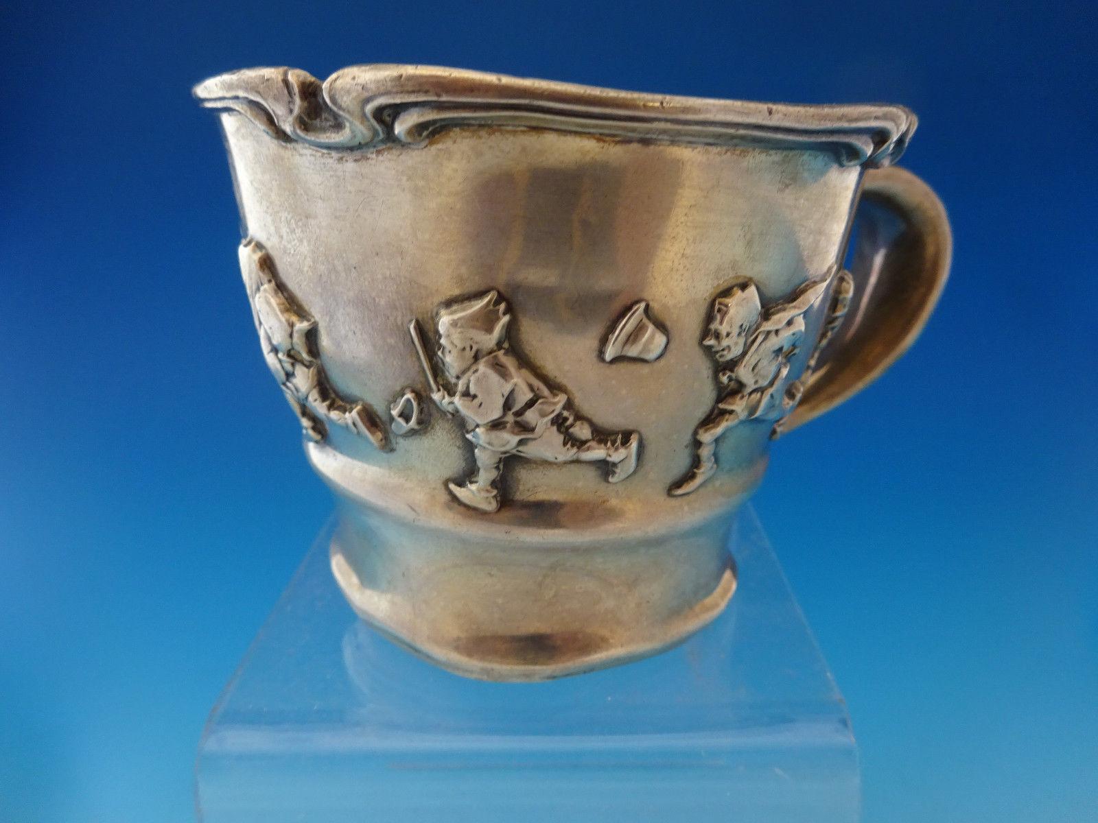 Shop Categories Helpful Links Gorham Old King Cole sterling silver child's cup GW 2 3/4 as-is with some dents

Sterling silver childs cup Gorham sterling silver child's cup with fabulous applied Old King Cole and fiddlers in the theme of the nursery