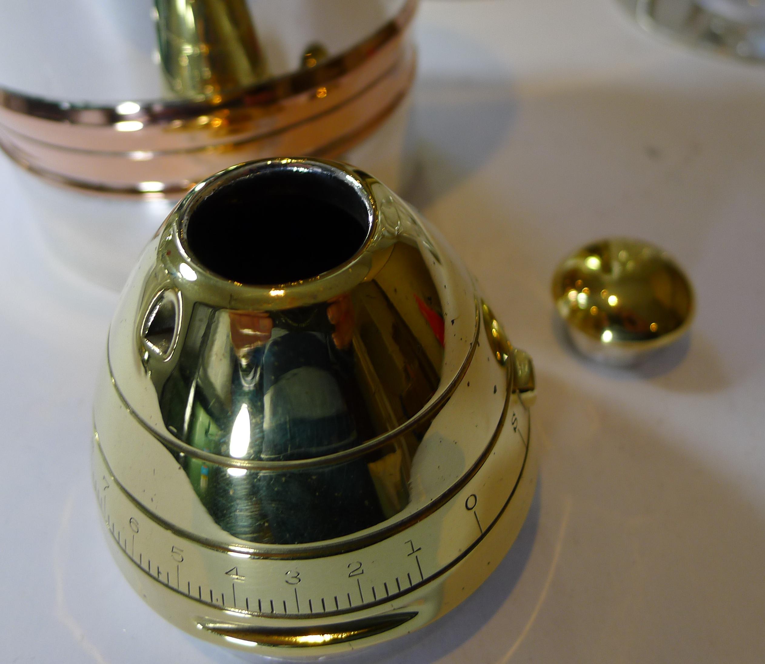 A magnificent and highly sought-after American Gorham Silver Company Cocktail Shaker created in the form of an WW1 Artillery gun shell.

Made from silver plate, gold plate and copper; the front part of the shell is the cocktail shaker marked on