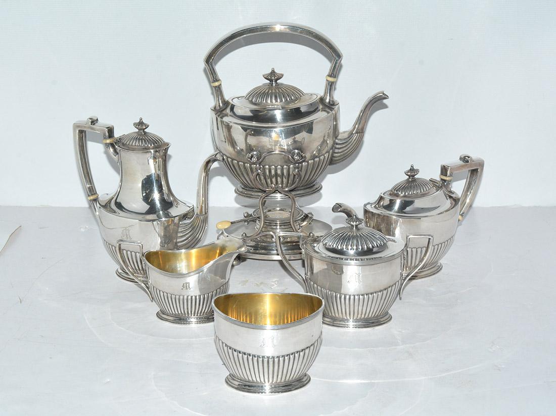All monogrammed M, a set of 6, comprising kettle on stand, coffee pot, tea pot, covered sugar bowl, cream jug and waste bowl, partially ribbed body, Gorham mark for 1911.
OFFERING FREE SHIPPING ON THIS ORDER WITHIN CONTINENTAL US.  PLEASE JUST