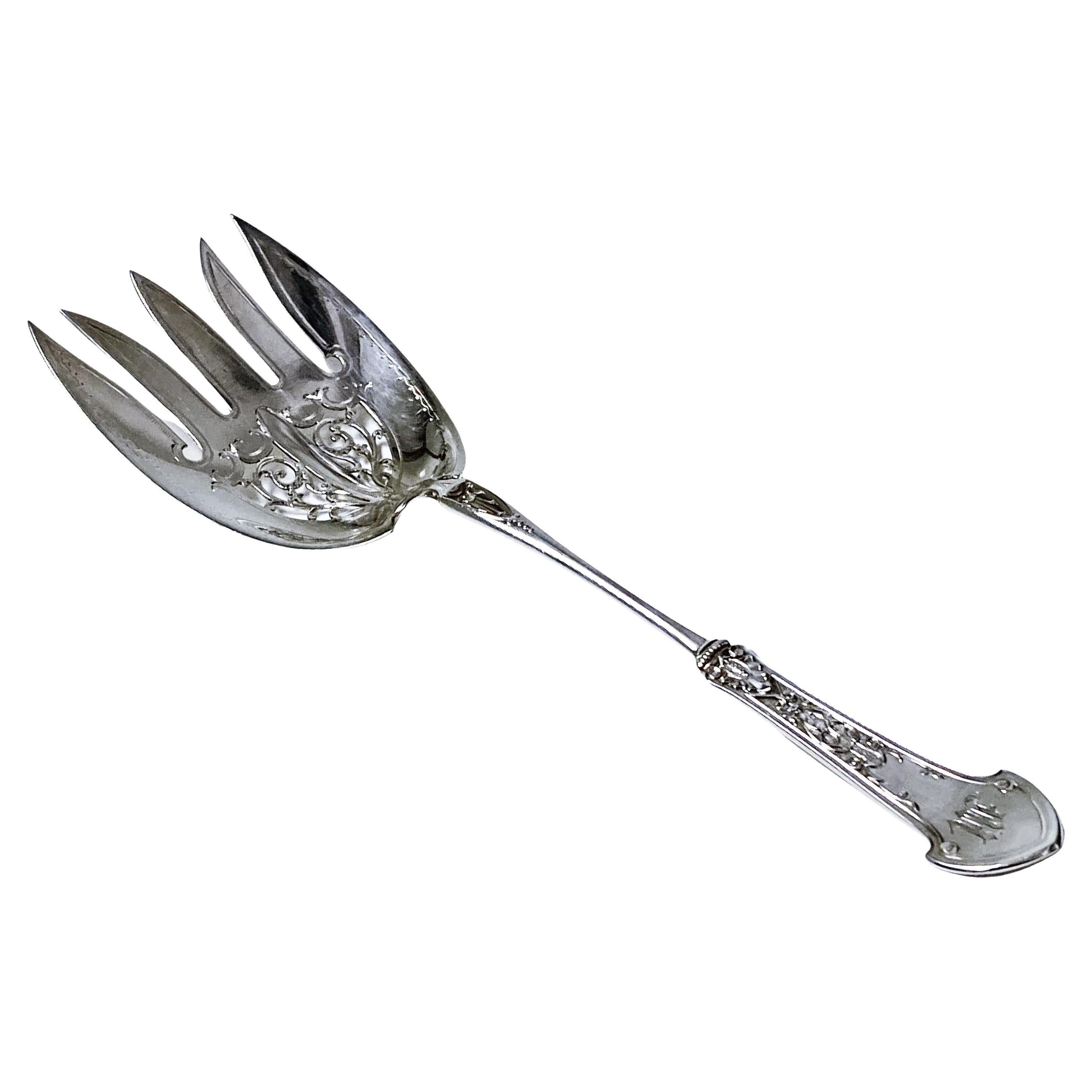Gorham Sterling Corinthian pattern large Serving Fork 1871. Full Gorham sterling marks. Monogram possibly M. Length: 9.5 inches. Width of tines: 3 inches. Item Weight: 85.42 grams. Very good condition