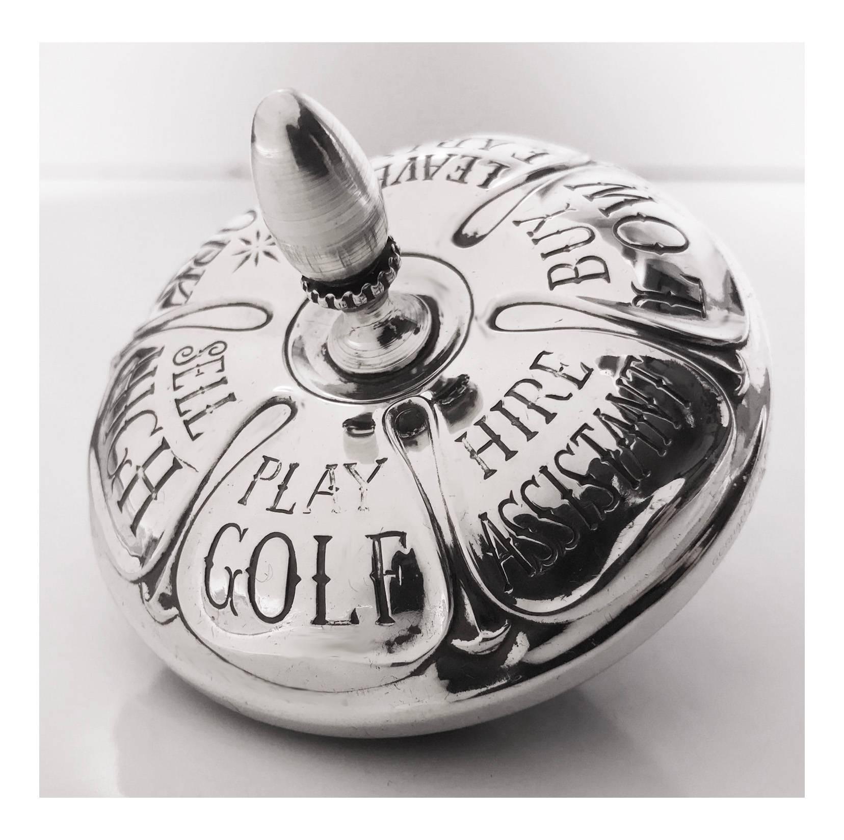 Gorham sterling executive decision making spinning top, circa 1940. The sterling silver top engraved with: Sell High - Play Golf - Hire Assistant - Buy Low - Leave Early - Work. Dimensions: 2 3/4 inches, diameter by 2 3/4 inches high. Ebony base.