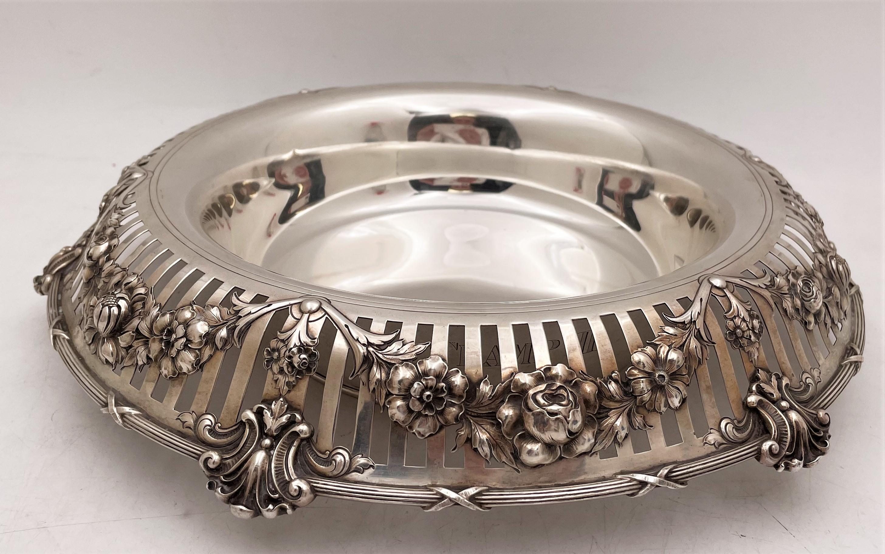 Gorham, sterling silver centerpiece bowl from 1911 in Art Nouveau style with exquisite, realistic, floral garlands in relief on the pierced rim of the bowl. It measures 12 1/2'' in diameter (inner diameter is 9'') by 2 7/8'' in height, weighs 28.7