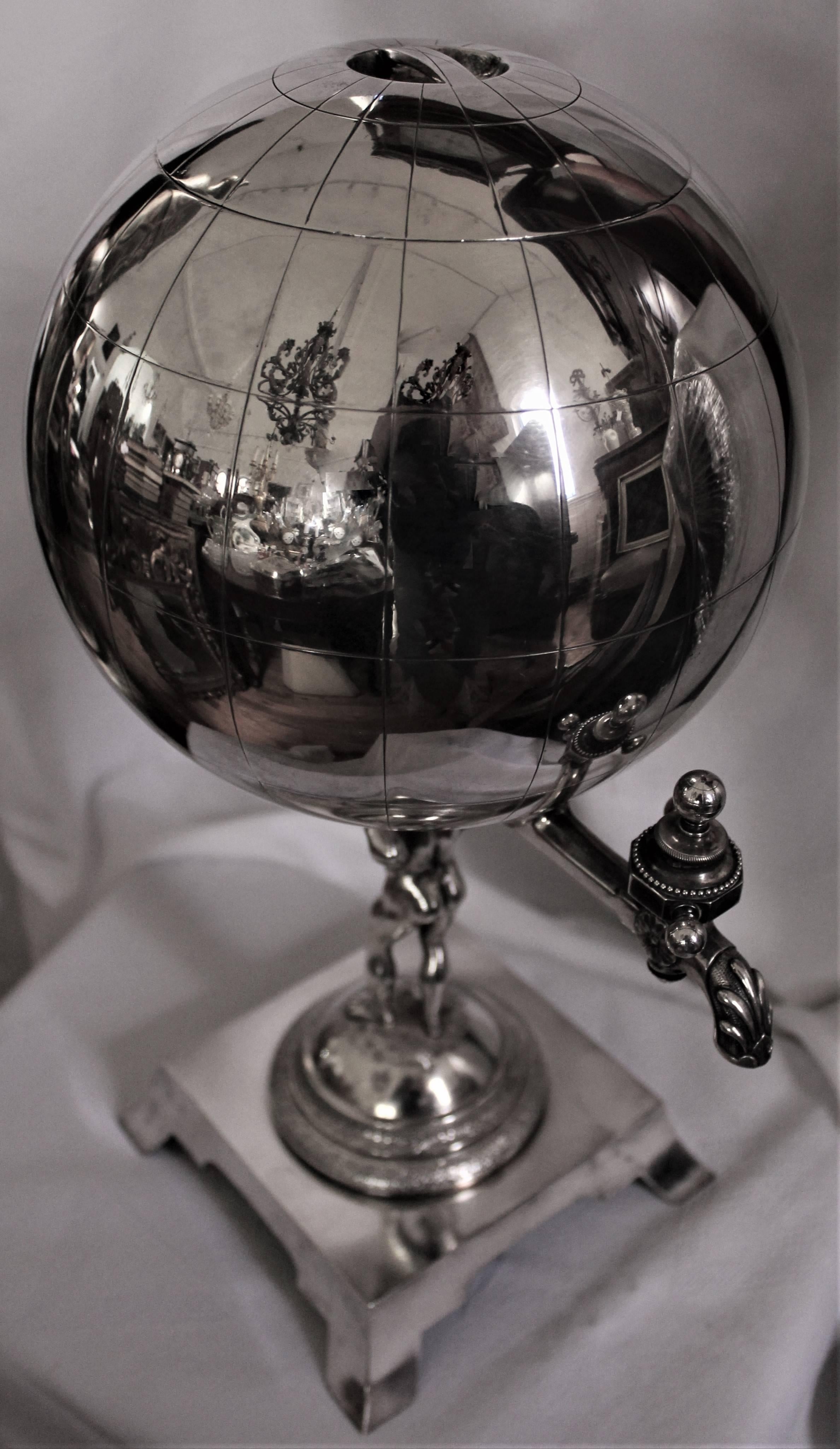 19th century Gorham sterling silver figural tea urn. It's Atlas (or Hercules) holding the world. 64 Ounces made in America Hallmark 1873. Lid is 5 inches round. 10 inches to the spigot. Globe is 8 inches round. Base is 6 inches square. Engraved
