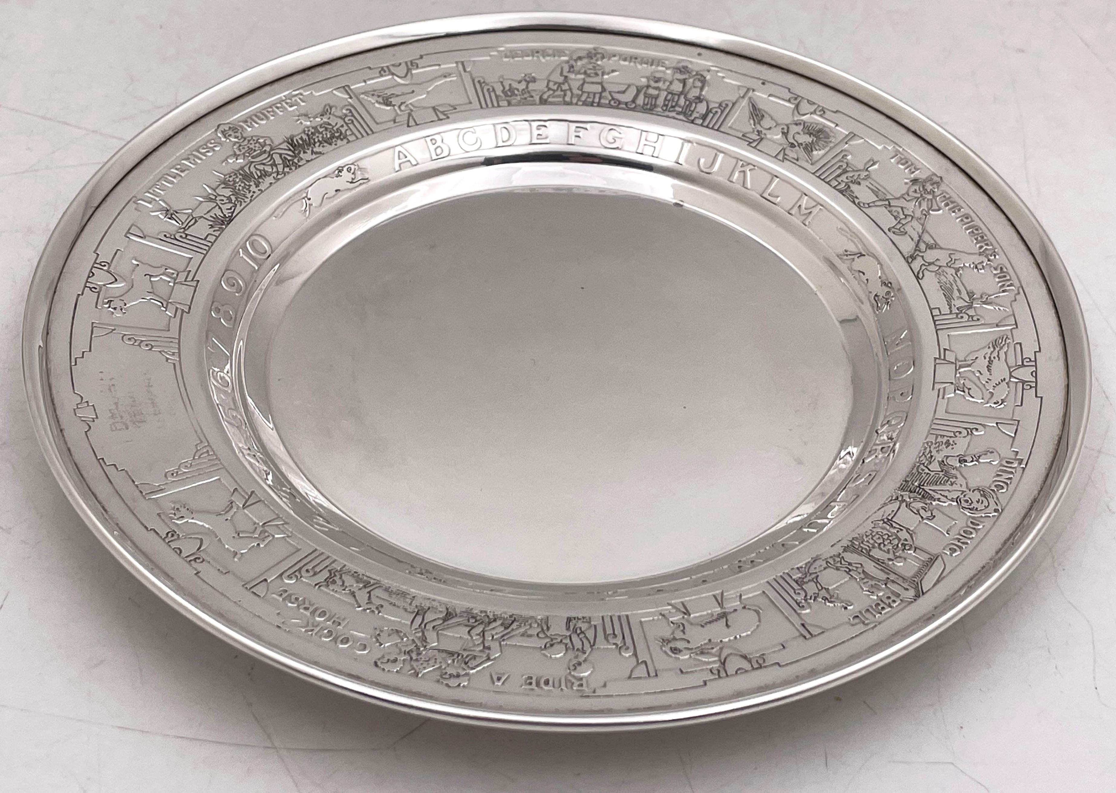 Gorham sterling silver child bowl and underplate from the 20th century, beautifully acid etched with children's stories including Little Red Riding Hood, Little Miss Muffet, and Puss in Boots, as well as animals, numbers, and the letters of the