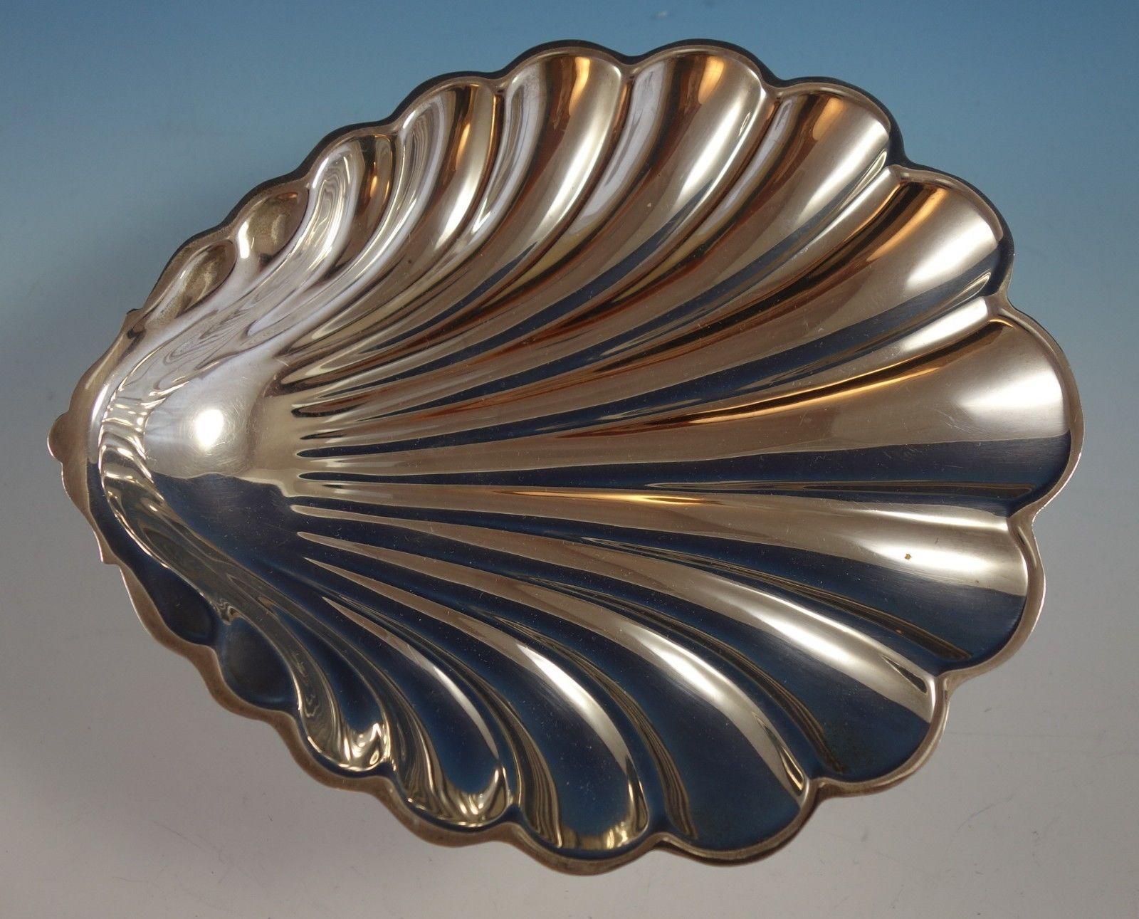 Beautiful Gorham sterling silver shell shaped dish with ball feet marked #42606. The dish measures 1 3/8