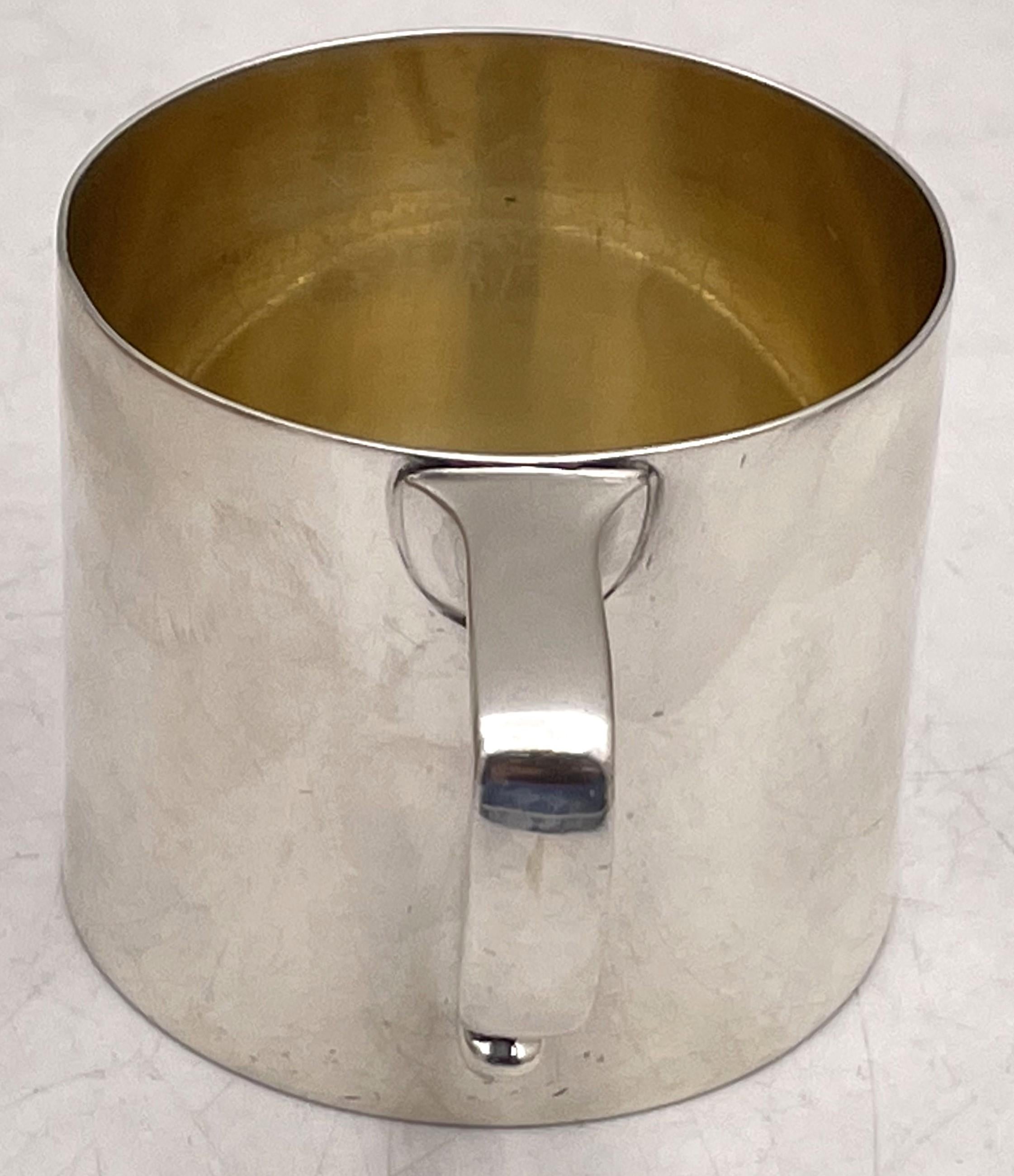 Gorham sterling silver child's or christening mug, made in the early 20th century, gilt inside, in Art Deco style with an elegant, geometric design. It measures 2 5/8'' in height by 2 2/3'' in diameter at the top, weighs 5.9 troy ounces, and bears