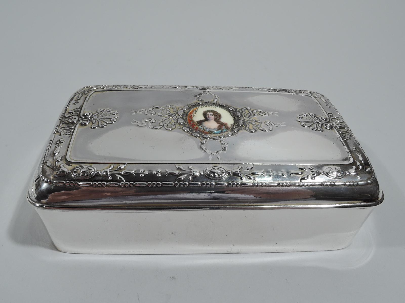 Edwardian Regency sterling silver jewelry box. Made by Gorham in Providence in 1896. Rectangular with curved corners. Cover hinged and raised with central enamel medallion depicting Baroque beauty with beaded border and set in wreath and ribbon
