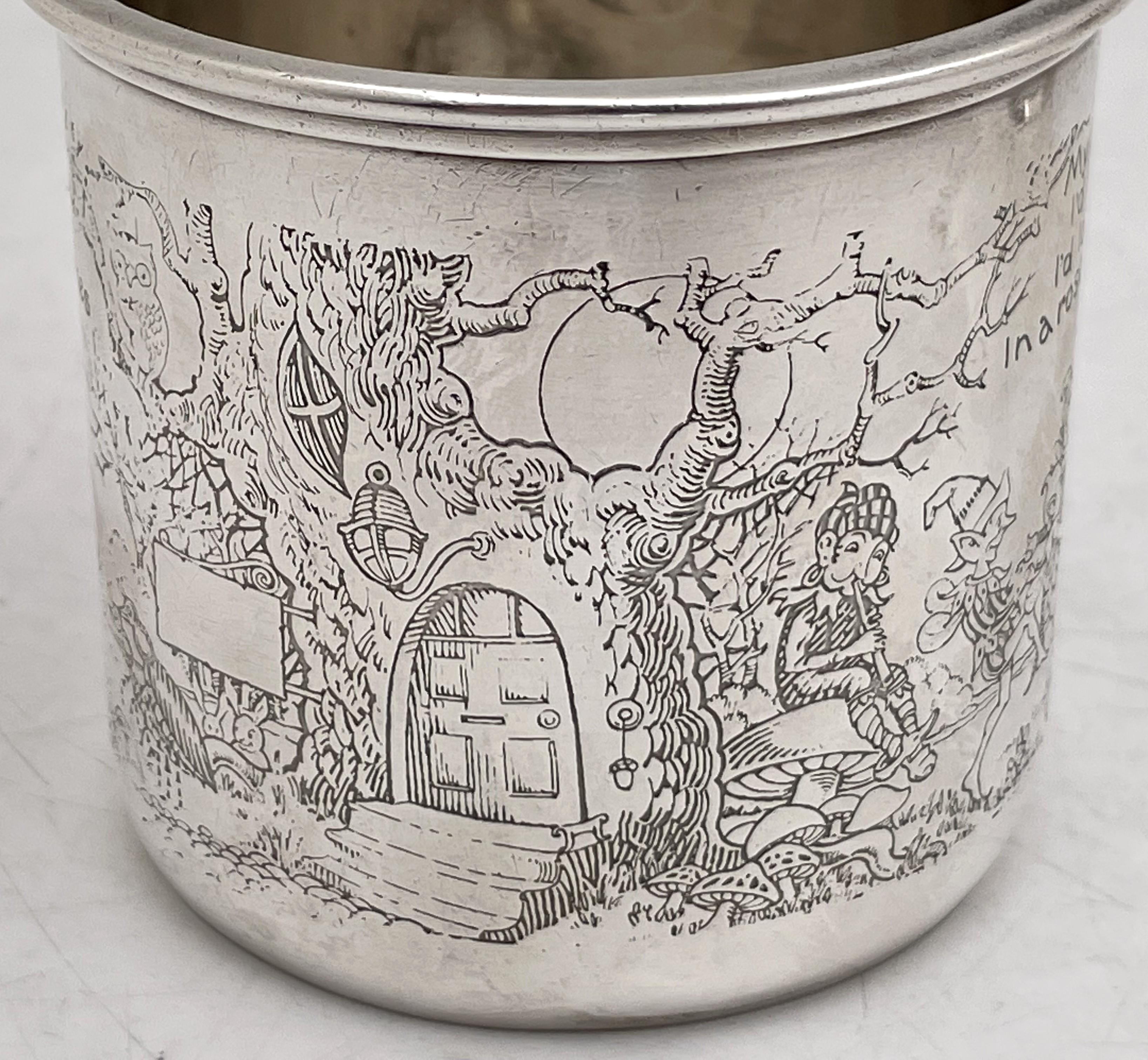 Gorham sterling silver child's or christening mug, from the early 20th century, adorned with acid-etched motifs including elves, rabbits, and trees. This collector's piece measures 2 5/8'' in height by 2 3/4'' in diameter at the top, weighs 2.8 troy