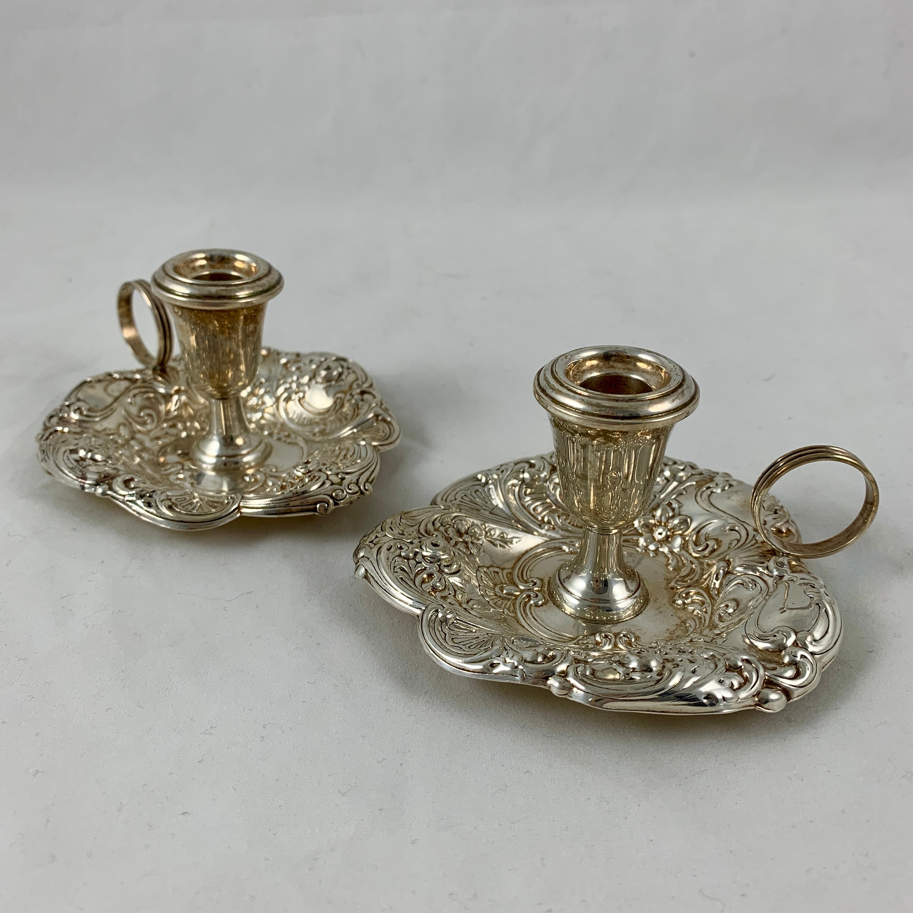 A pair of Gorham sterling silver Chambersticks, circa 1920-1930.
A beautiful Repoussé pattern of roses, fans, shells, and scrolls. Each with a finger holder, charming for the bedside.

Marked Gorham sterling silver 324. Weighing approximately 2.6
