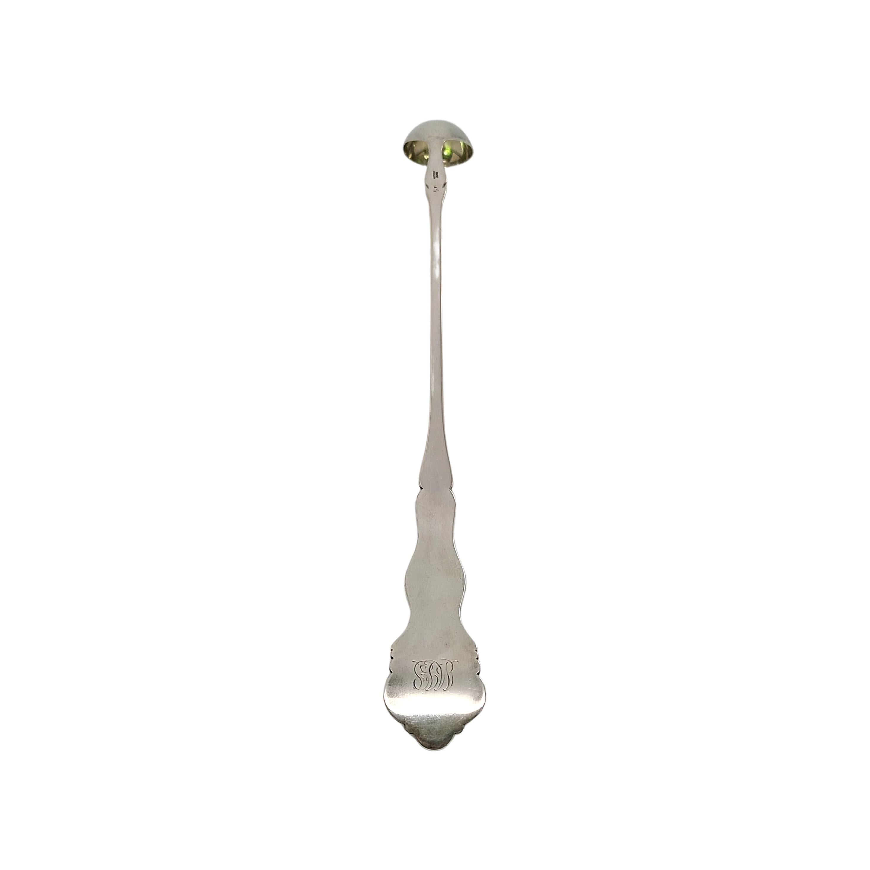 
Sterling silver with gold washed bowl claret ladle by Gorham in a Grapevine pattern.

Monogram appears to be MJP

This long ladle with a small bowl was used to scoop fruit out of a pitcher. It features a gold wash on the inside of the bowl with