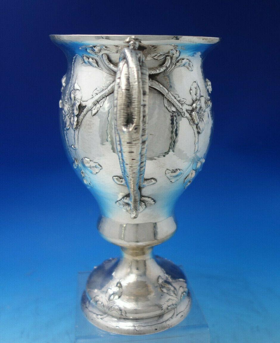 Gorham

Outstanding Gorham centerpiece vase marked #A5003. It is hand hammered and is beautifully hand engraved with wild roses. It measures 10