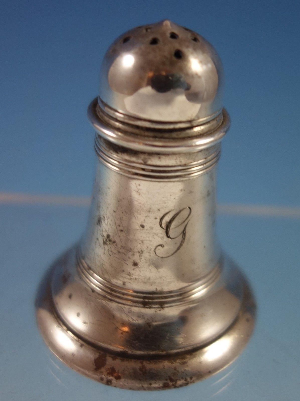 Gorham/Durgin sterling silver pepper shaker and three salt dips. The pieces are monogrammed (see photos), and are marked with #700. The salt dips measure 3/4 x 1 5/8, and the pepper shaker is 2 x 1/2. This 4-piece set weighs 2.76 ozt., and is in