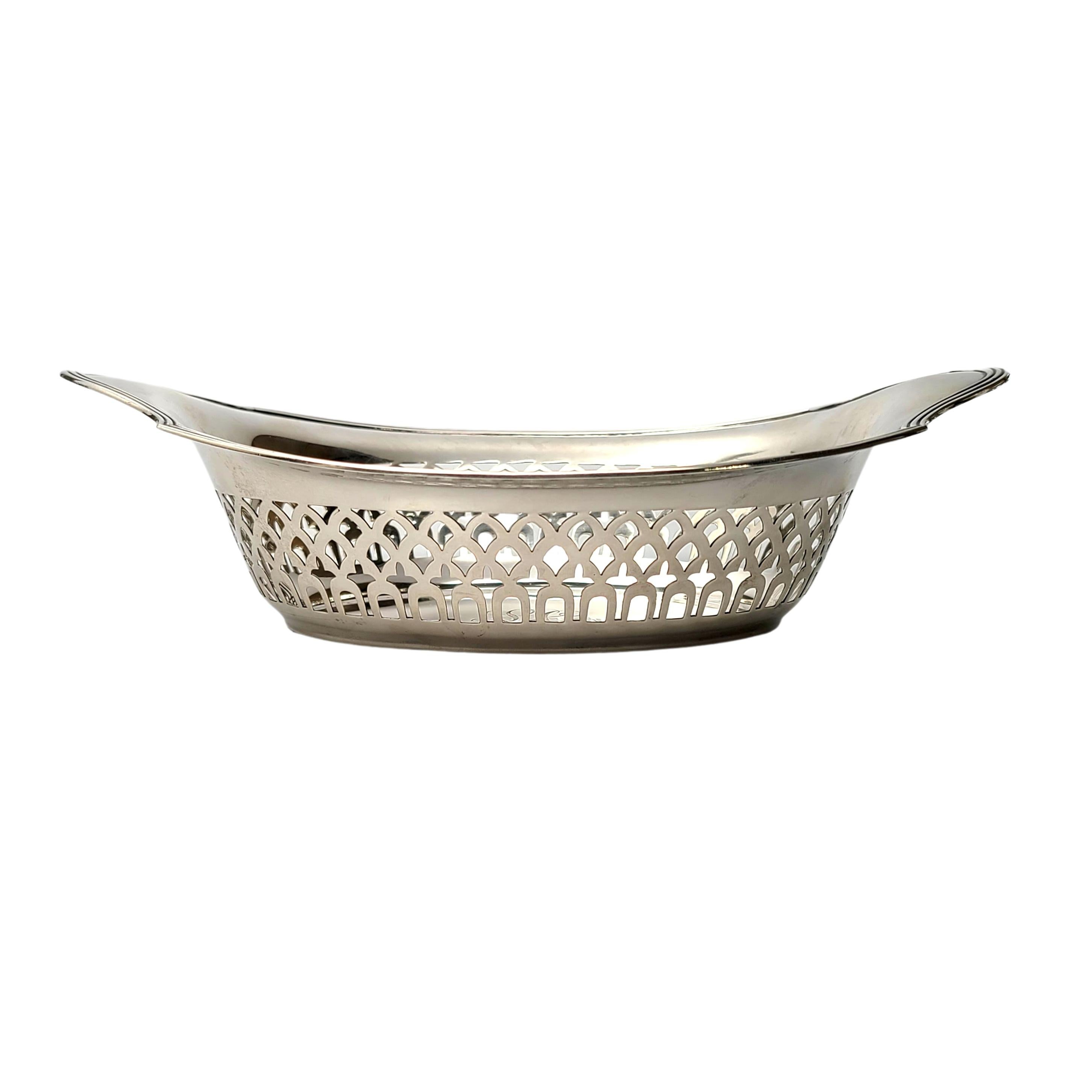 Sterling silver oval dish by Gorham in the Plymouth pattern with monogram, circa 1912.

Monogram appears to be LC

Gorham's Plymouth pattern is a simple and timeless design. This piece features open work on the sides, and a monogram on the inside of