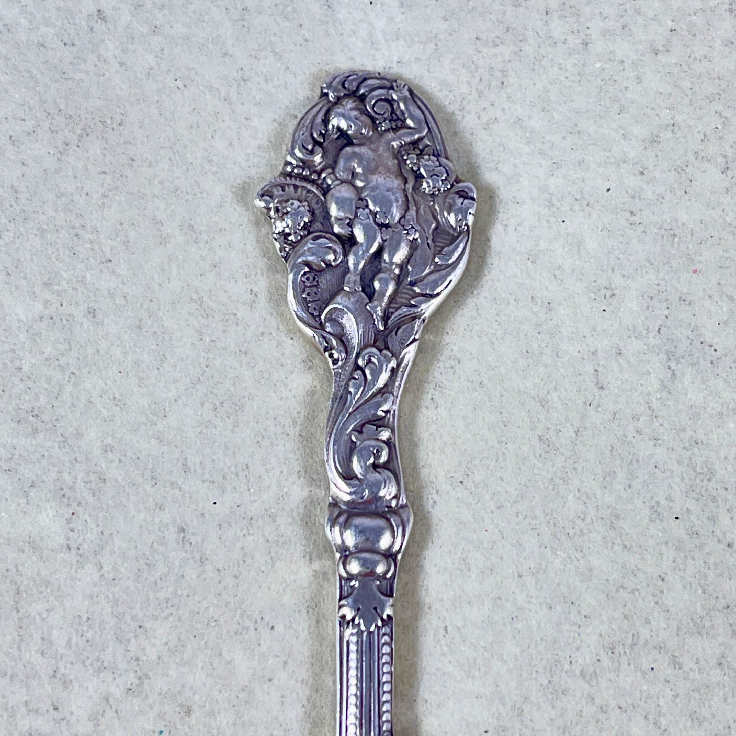 A set of twelve sterling silver butter or patè spreaders, in the ‘Versailles’ pattern from the Gorham Manufacturing Co. Providence Rhode Island, circa 1888.

Designed by Antone Heller, and named for the palace of Versailles, the residence of King