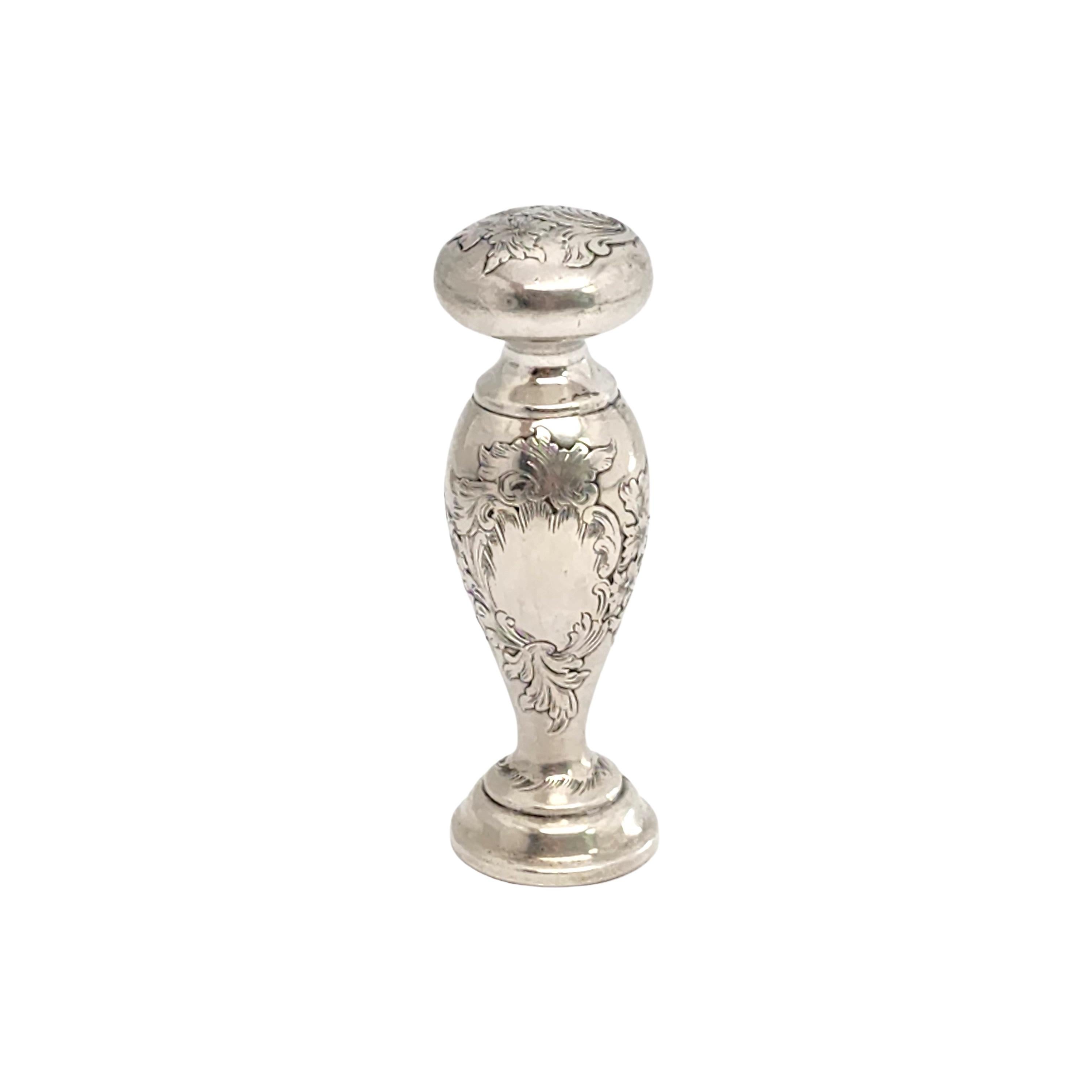 Sterling silver wax seal stamp by Gorham.

No monogram

Bulbous designed stamp with a flower and leaf etched design on top, an an etched scroll, flower and leaf design around a blank cartouche. Plan round stamp bottom.

Measures approx 2 3/4