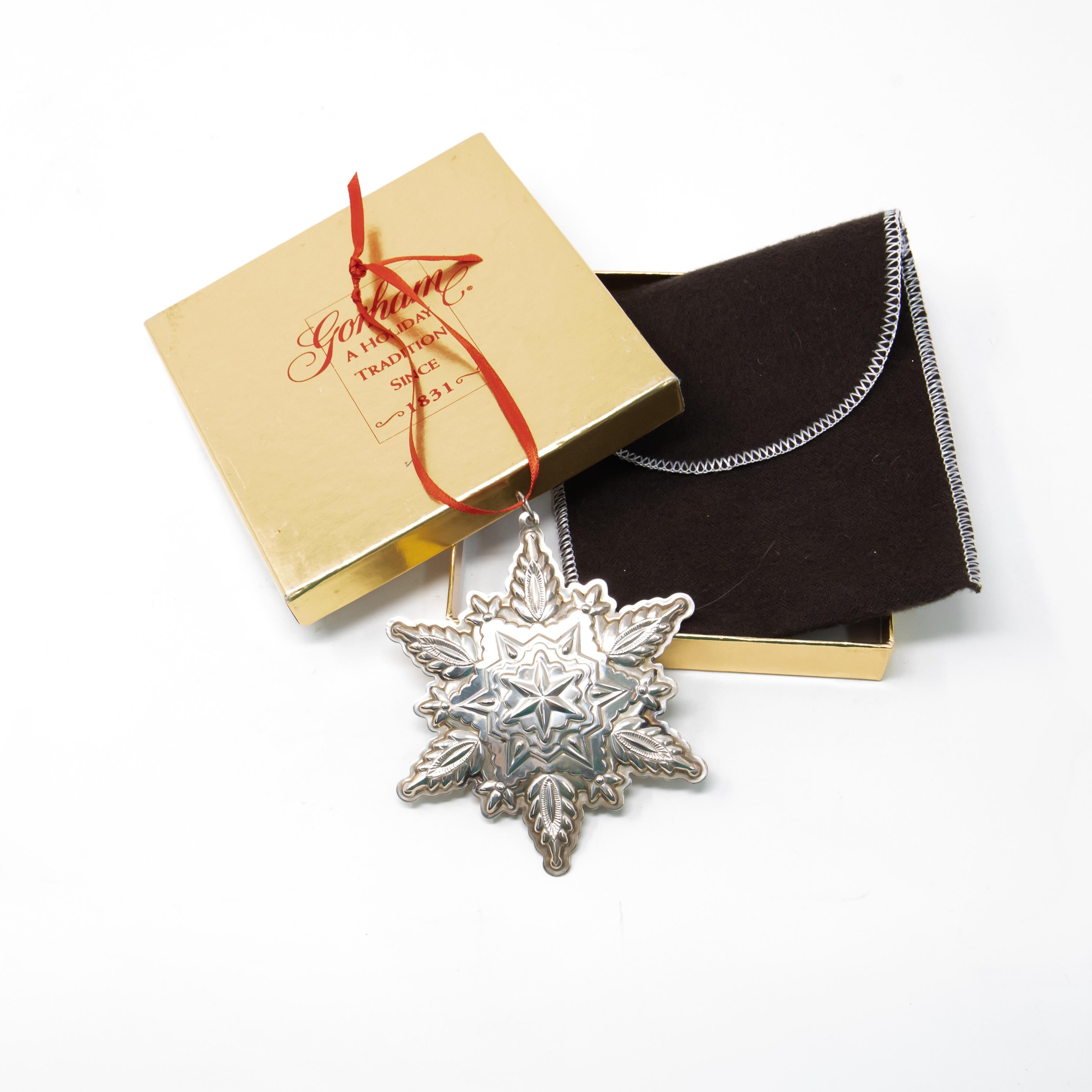Offering a beautiful Gorham Sterling snowflake from 1999. Starting in the center with a 6 point star goes outward with many geometric patterns. Back is inscribed with Gorham Sterling, trademarks, Christmas, 1999.